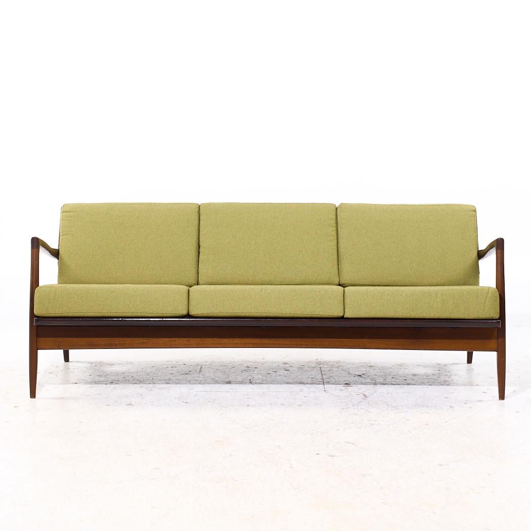 Kofod Larsen for Selig Mid Century Danish Walnut Sofa

This sofa measures: 74 wide x 32 deep x 27 inches high, with a seat height of 17 and arm height of 23.5 inches

All pieces of furniture can be had in what we call restored vintage condition.