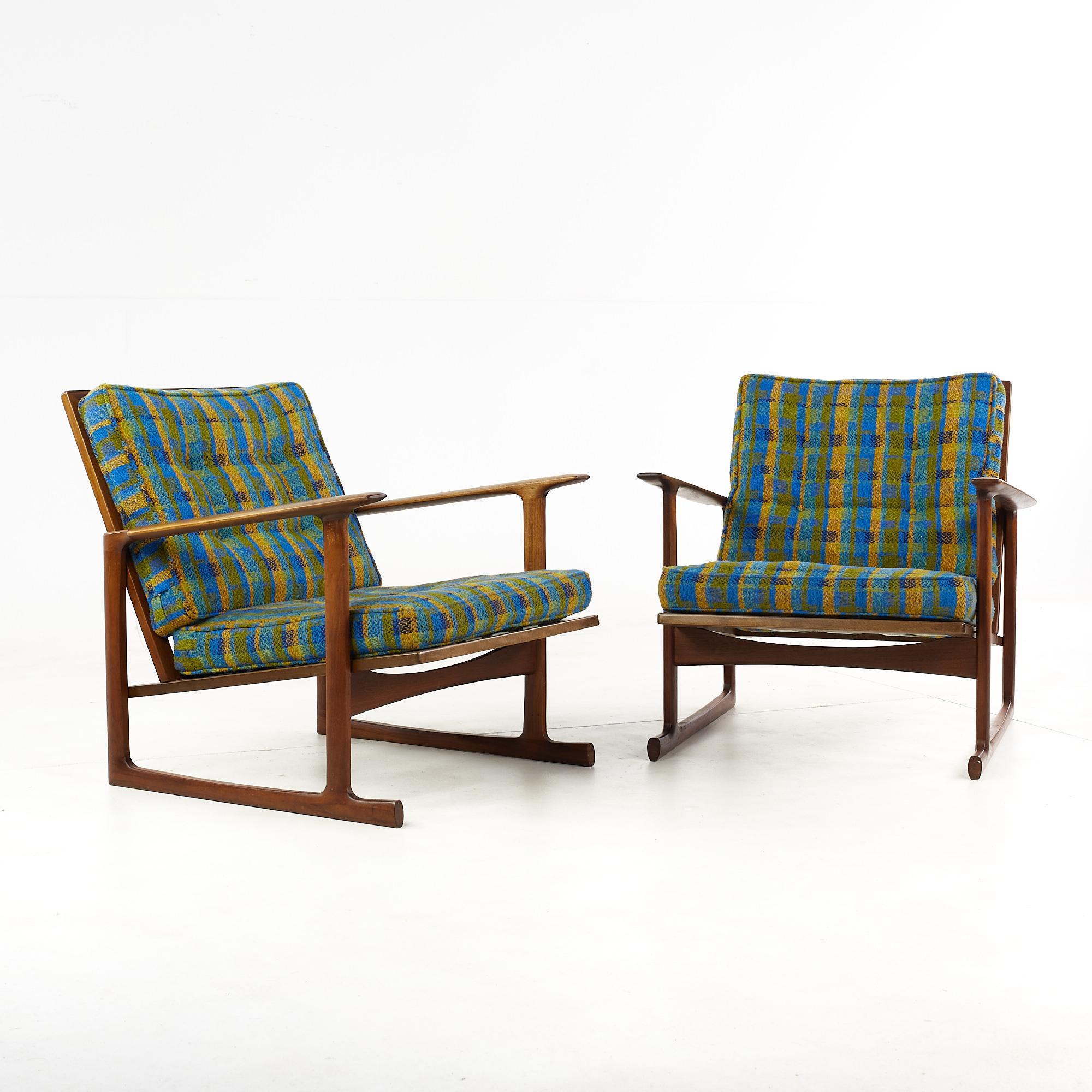 Kofod Larsen for Selig Mid Century Sleigh Leg Low Back Lounge Chairs - Pair

These chairs measure: 29 wide x 31 deep x 28 inches high, with a seat height of 16 and arm height/chair clearance of 22 inches

All pieces of furniture can be had in what