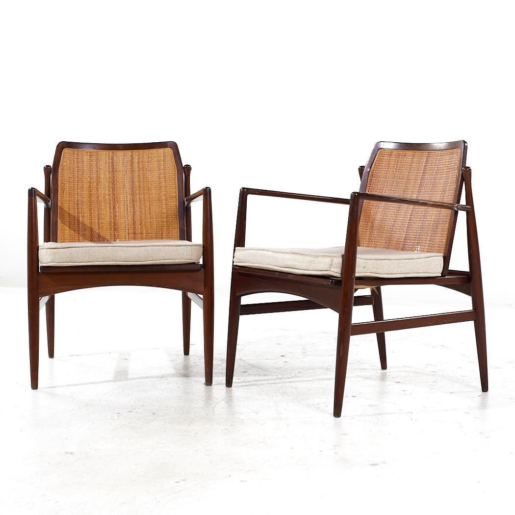 Mid-Century Modern Kofod Larsen for Selig Mid Century Walnut and Cane Lounge Chairs - Pair For Sale