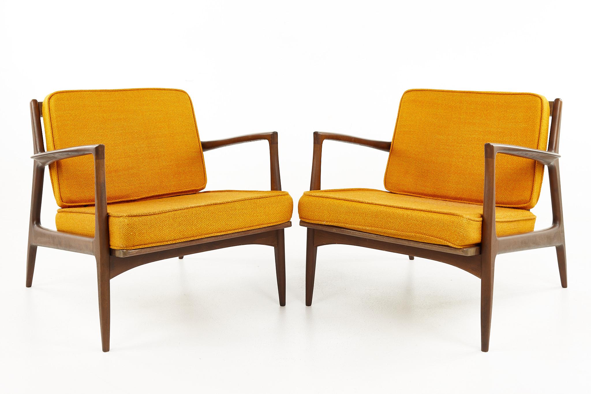 Kofod Larsen for Selig mid century walnut lounge chairs - a pair

Each chair measures: 30.25 wide x 33 deep x 27 high, with a seat height of 15.5 inches and arm height of 22.75 inches 

All pieces of furniture can be had in what we call restored