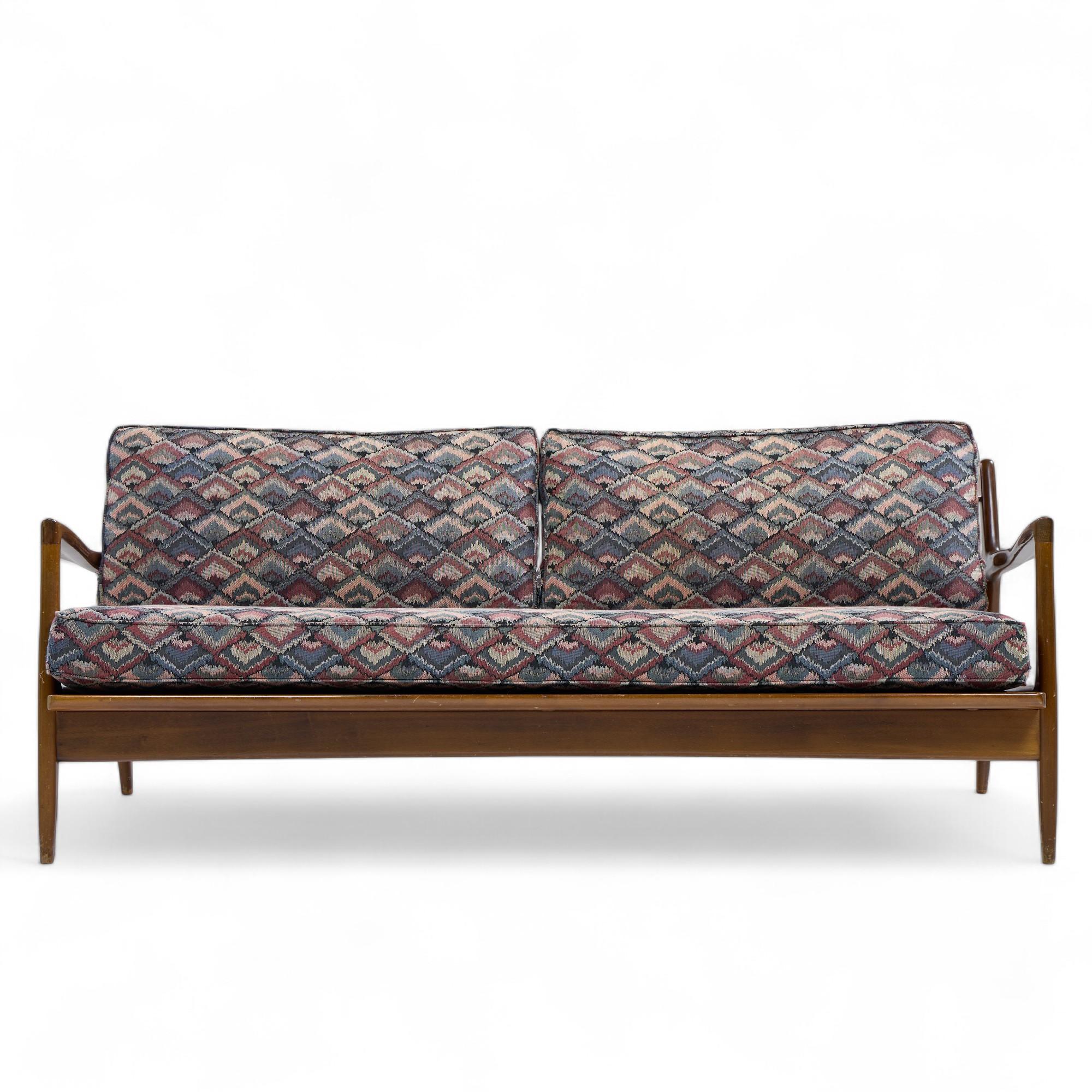 Kofod Larsen for Selig Mid Century Walnut Sofa

This sofa measures: 75 wide x 30 deep x 30 inches high, with a seat height of 18 and arm height of 23.75 inches

Fair Vintage Condition - Scuffs and Minor Scratches throughout Sofa Frame. Cushions are