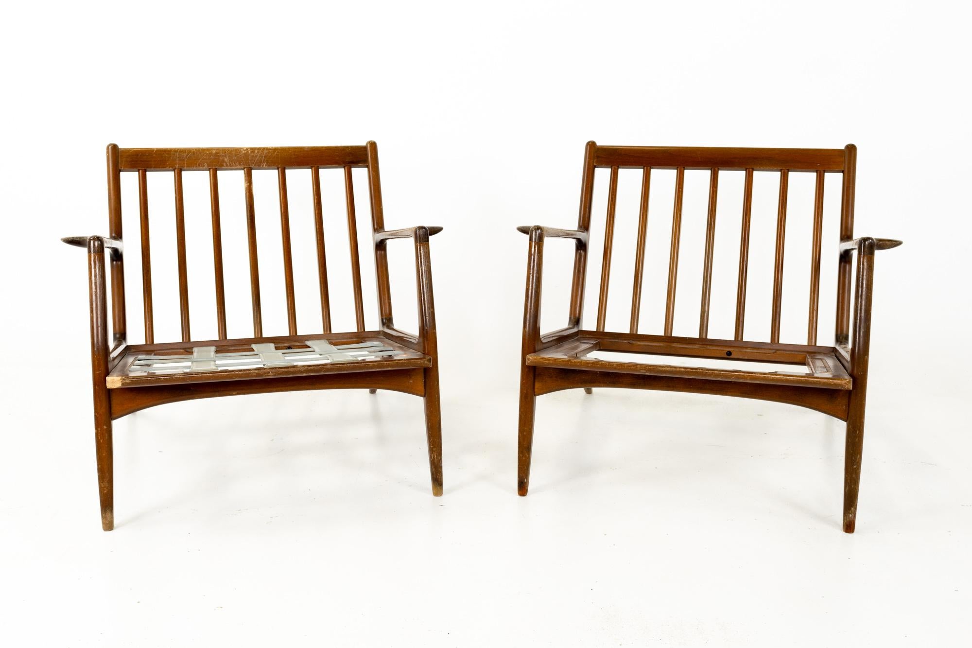 Kofod Larsen for Selig Mid Century Danish lounge chairs, pair
These chairs are 30 wide x 30 deep x 27 inches high, with a seat height of 11.75 and an arm height of 21 inches

This piece is available in what we call restored vintage condition. Upon