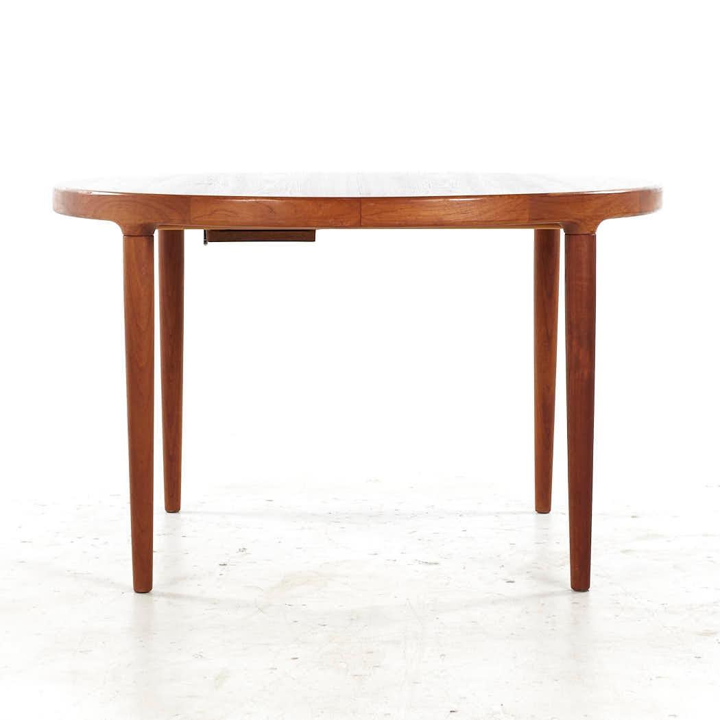 Kofod Larsen Mid Century Danish Teak Expanding Dining Table with 3 Leaves

This table measures: 47 wide x 47.25 deep x 28.75 inches high, with a chair clearance of 26.5 inches, each leaf measures 19.75 inches wide, making a maximum table width of