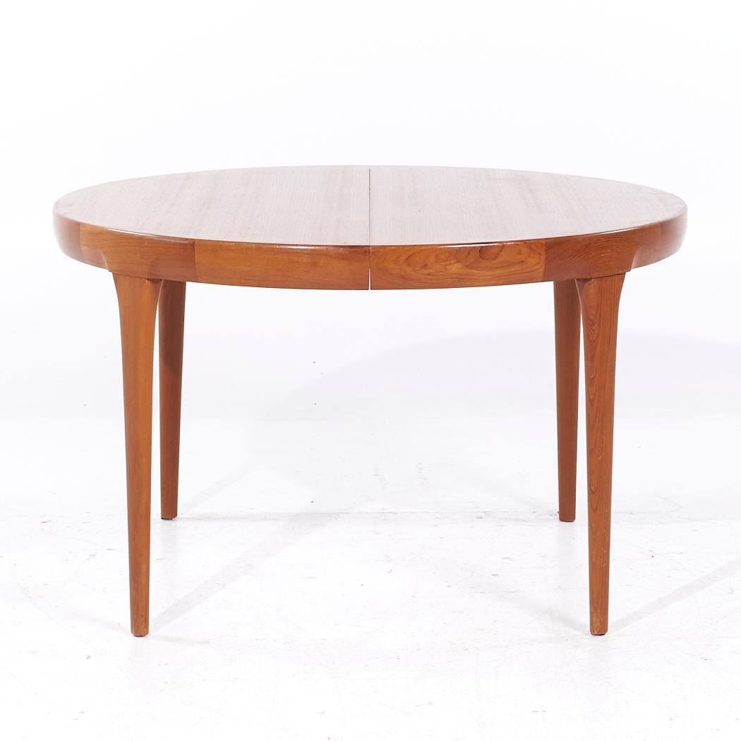 Kofod Larsen Mid Century Danish Teak Expanding Dining Table with 3 Leaves

This table measures: 47 wide x 47 deep x 28.5 inches high, with a chair clearance of 25.5 inches, each leaf measures 19.75 inches wide, making a maximum table width of 106.25