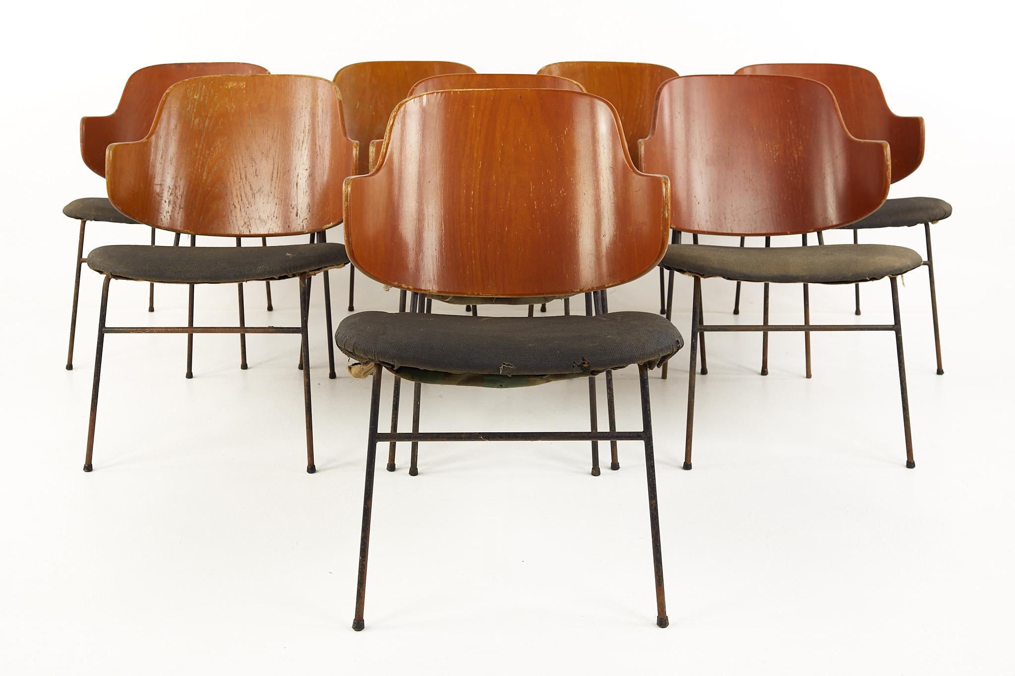 Kofod Larsen mid century penguin wrought iron and bent plywood dining chairs - Set of 8

Each chair measures: 20.5 wide x 24 deep x 28.75 inches high, with a seat height of 16 inches

Ready for new upholstery. This service is available for an