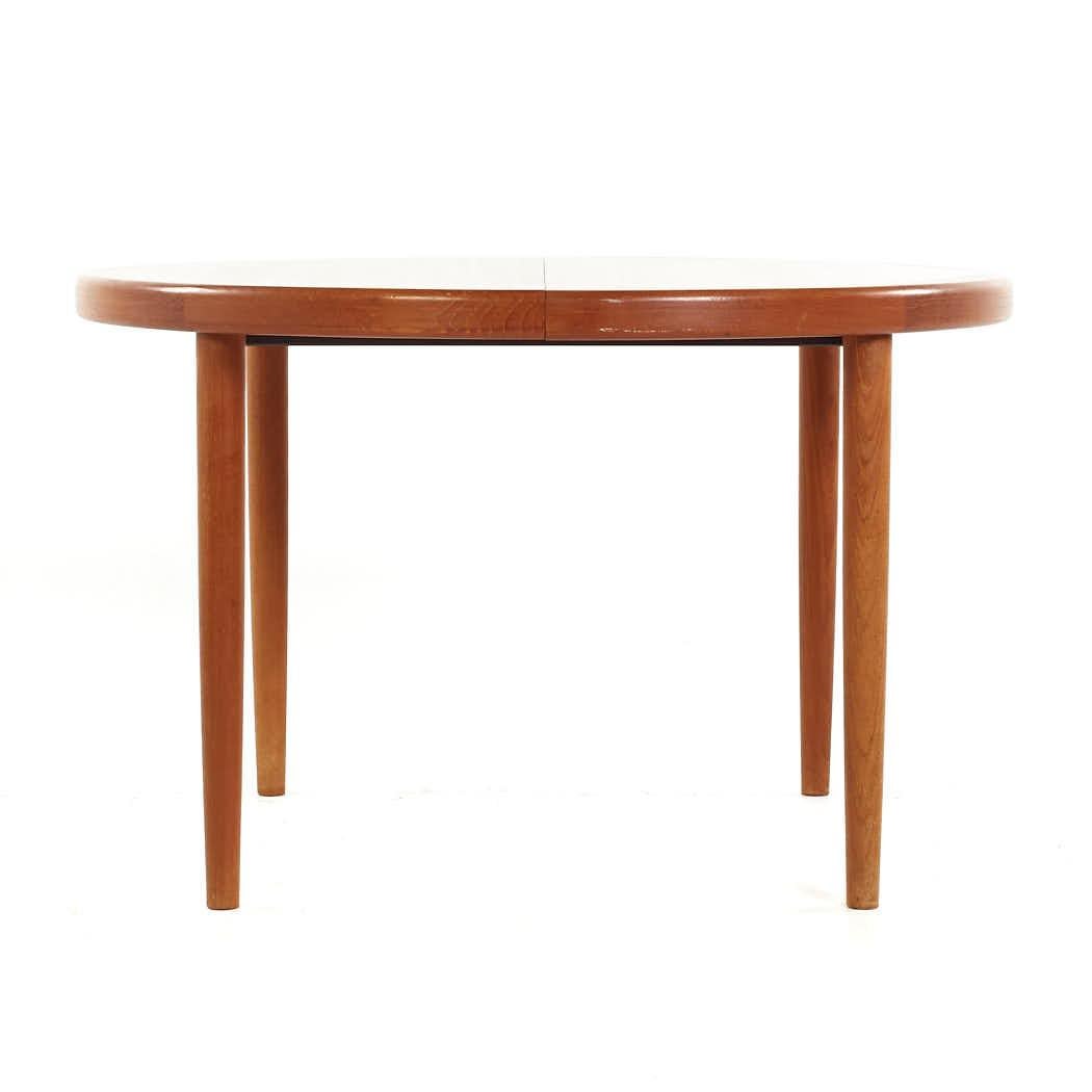 Kofod Larsen Mid Century Teak Expanding Dining Table 2 Leaves

This table measures: 46.75 wide x 46.75 deep x 29 inches high, with a chair clearance of 26.75 inches, each leaf measures 19.75 inches wide, making a maximum table width of 86.25 inches