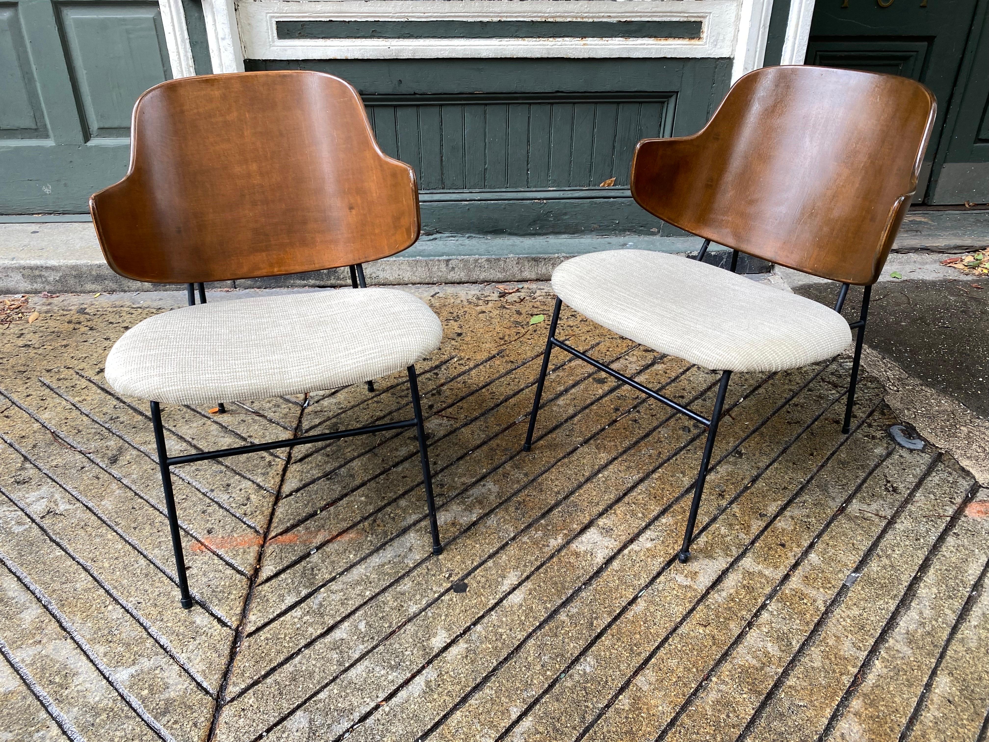 Ib Kofod Larsen Penguin chairs with walnut backs and black metal frames. Extremely comfortable and great scale!  Wood shows a little wear but all original.  Seat were recovered within last 5 years.
 