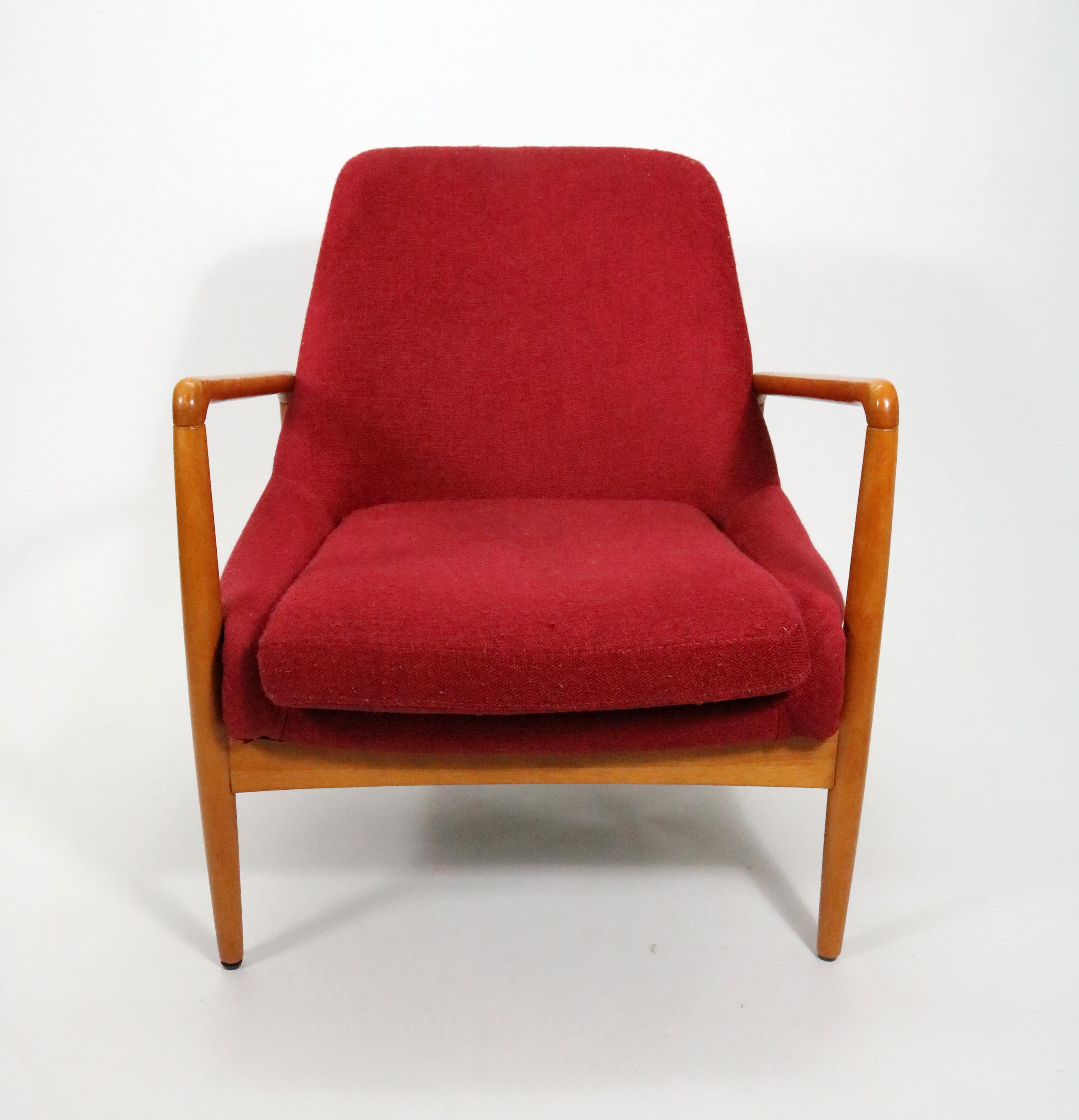A rare mid-century lounge chair in honey finish walnut by John Fossum for the Shield Chair Company of California. 

John K. Fossum grew up in California, the child of US immigrants from Norway and founded the Shield Chair Company of California in