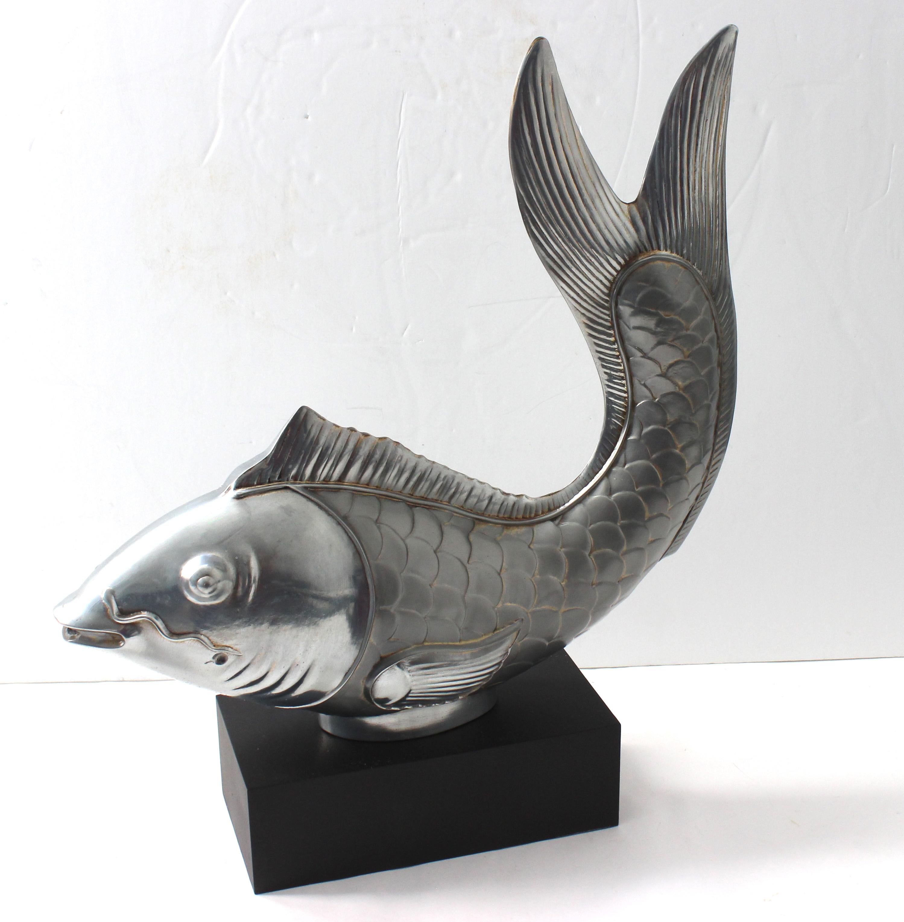 This stylish and charming figure of a Japanese carp (koi fish) dates to the 1970s-1980s and was created by Chapman.

Note: This piece has been professionally polished and the base re-painted.