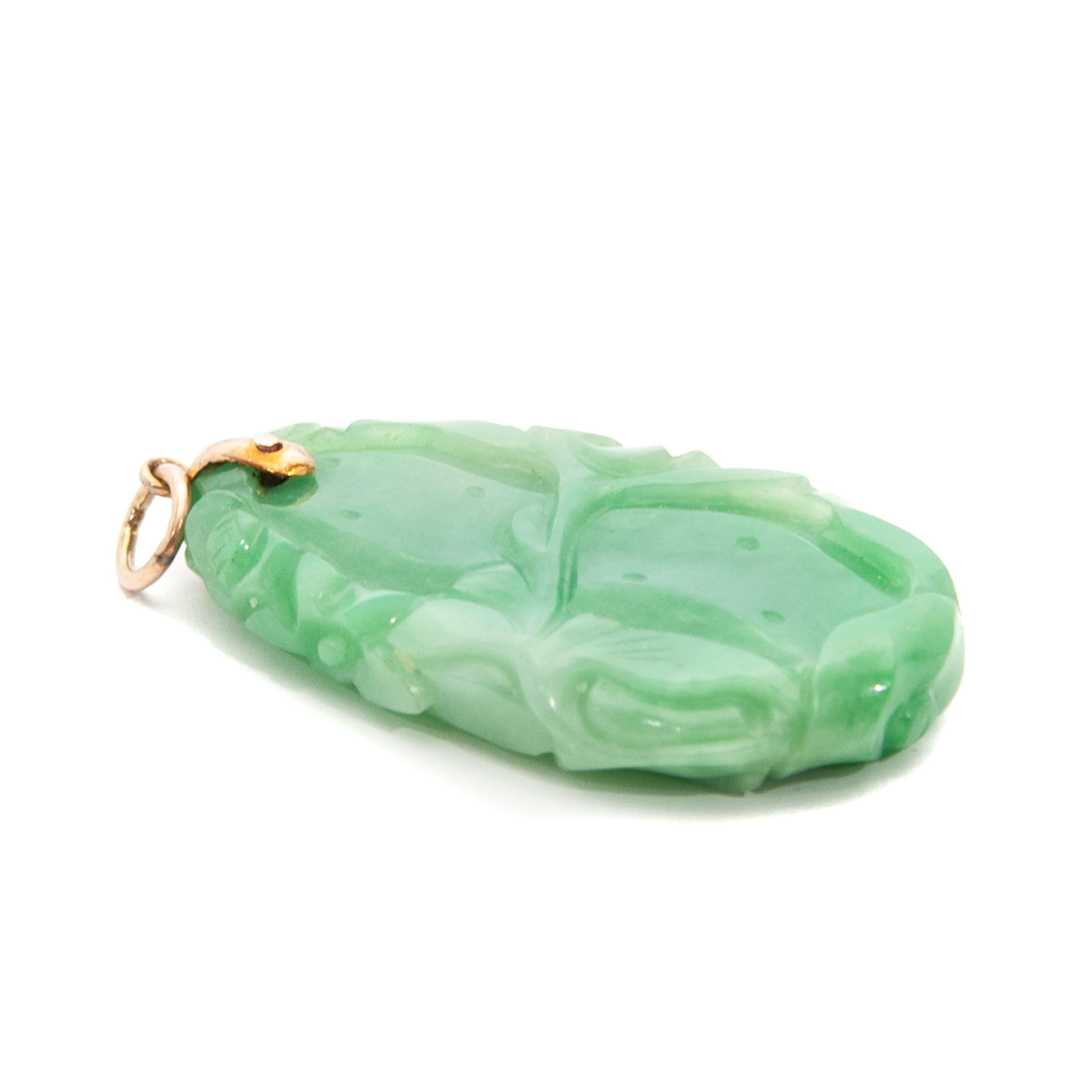 Oval Cut Fish and Floral Carved Green Jade Pendant