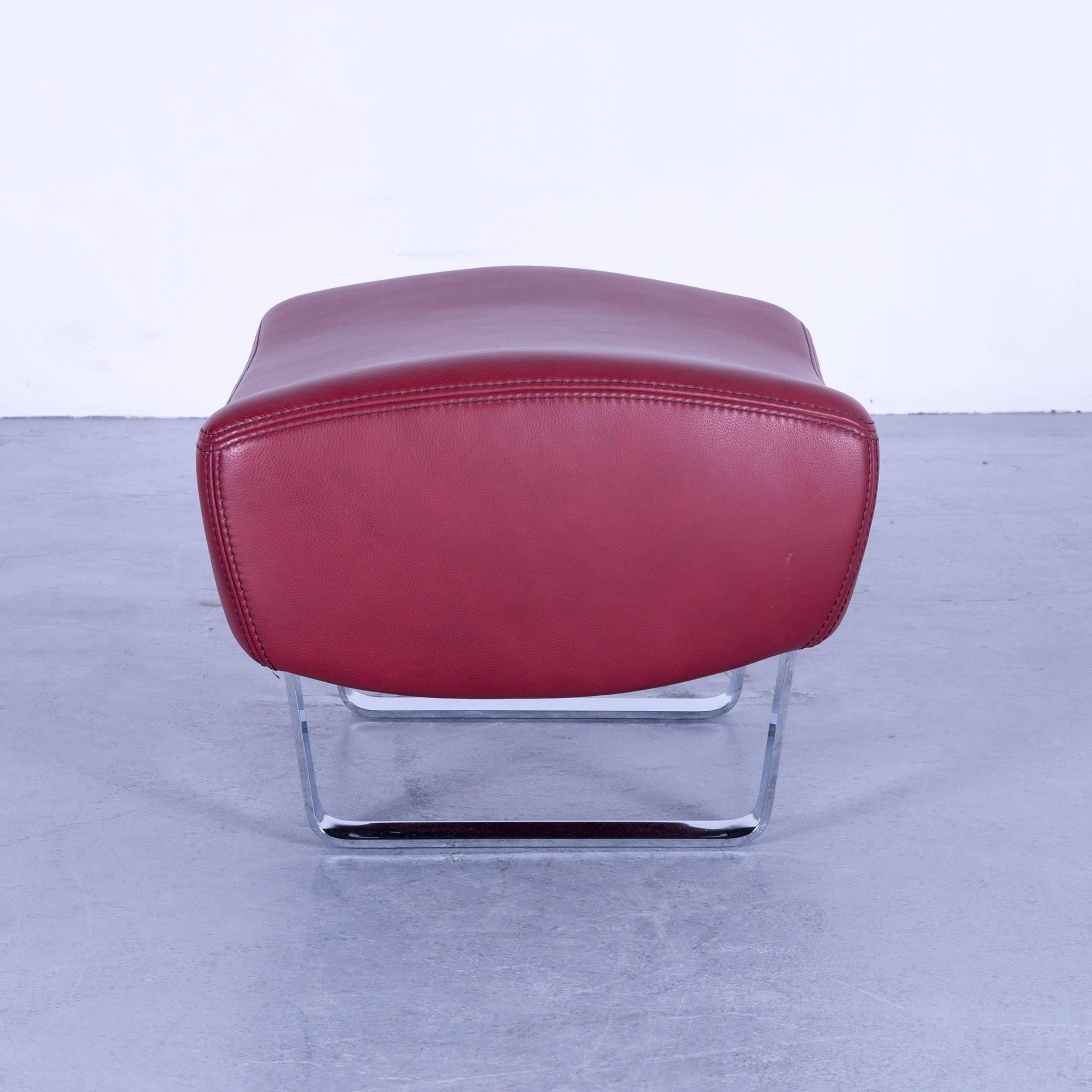 Koinor designer footstool Bordeaux wine red colored leather footrest pouf, made for pure comfort and flexibility.