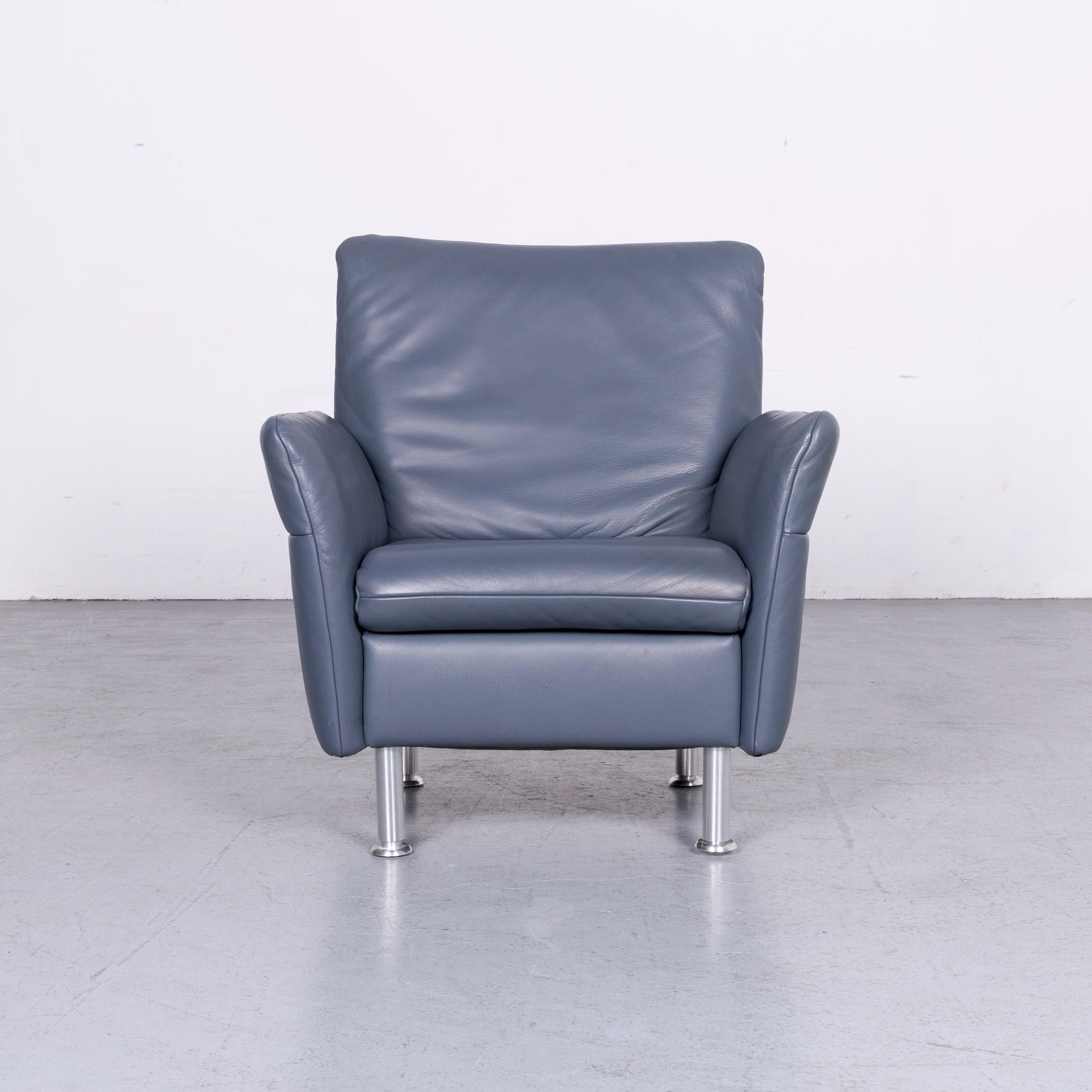We bring to you a Koinor designer one-seat sofa blue leather armchair.
