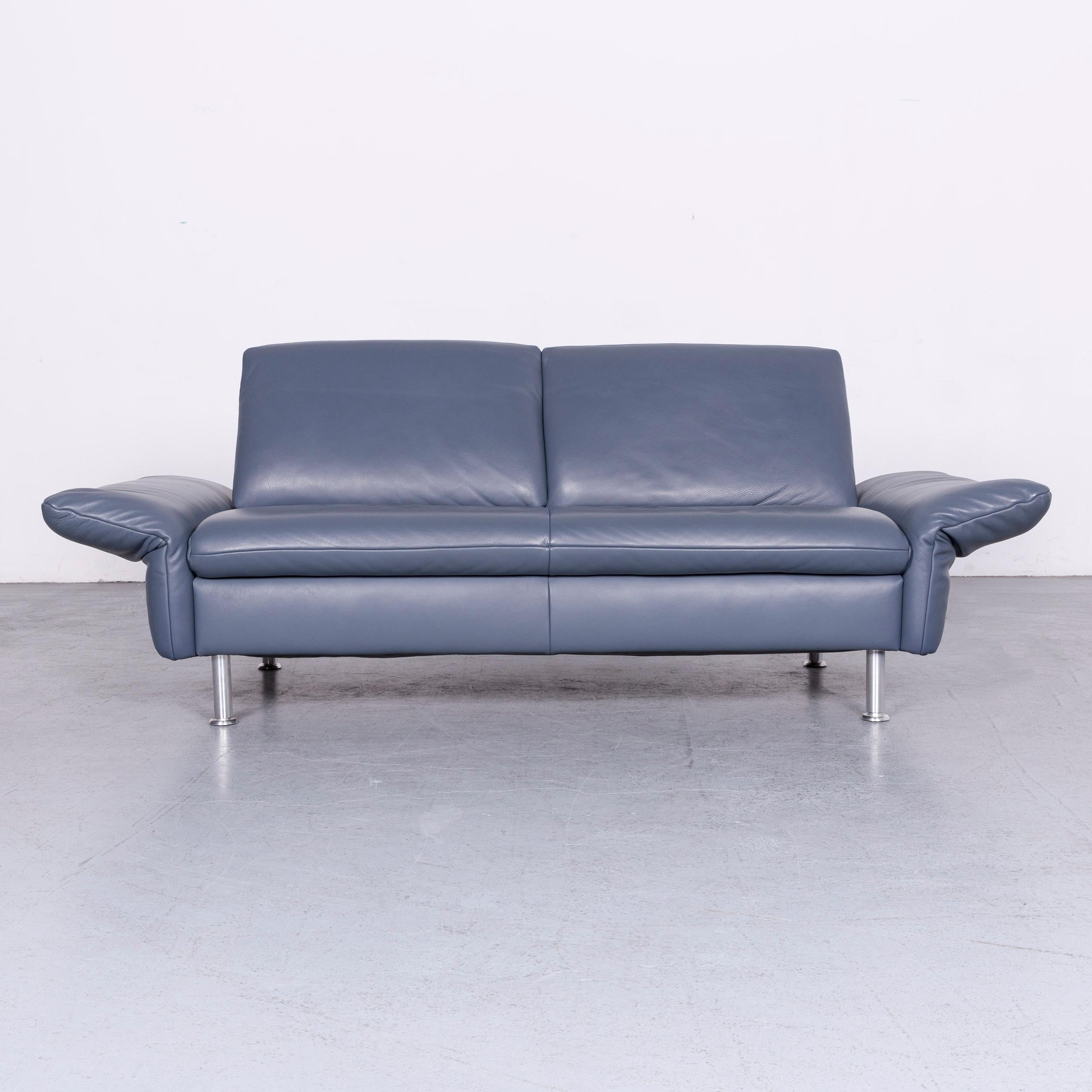 We bring to you a Koinor designer two-seat sofa armchair footstool set blue leather.