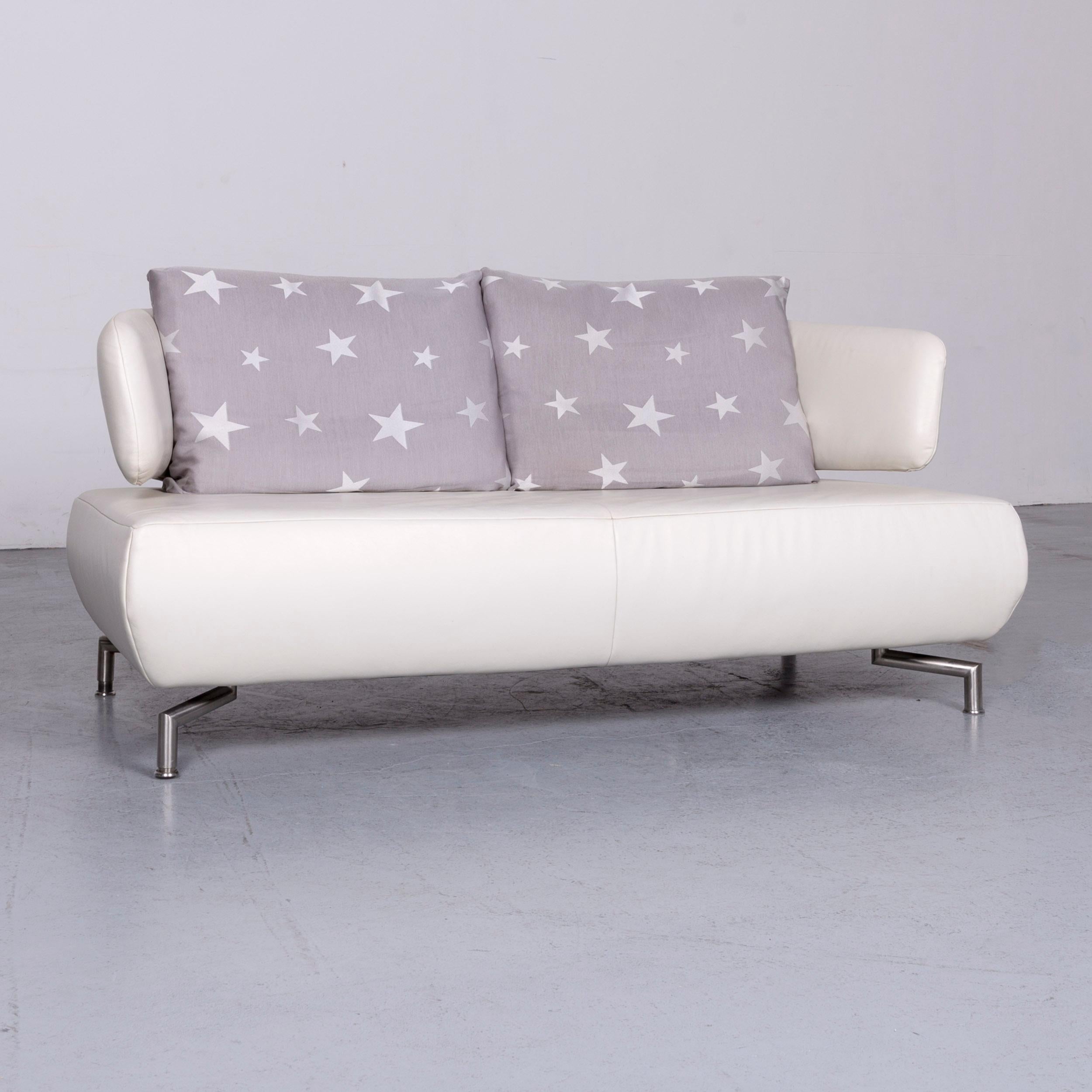 We bring to you a Koinor designer two-seat sofa white leather couch with pillow.