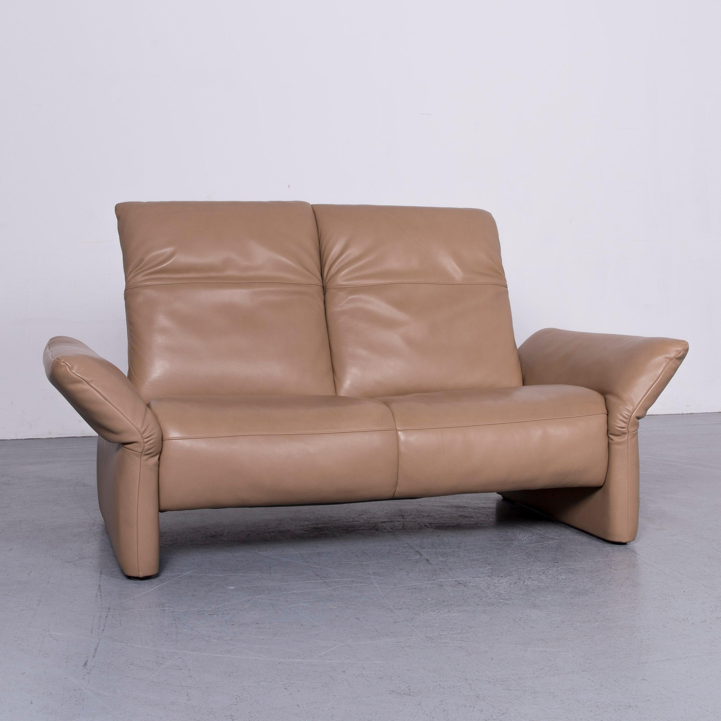 We bring to you a Koinor Elena designer two-seat sofa beige leather function couch.