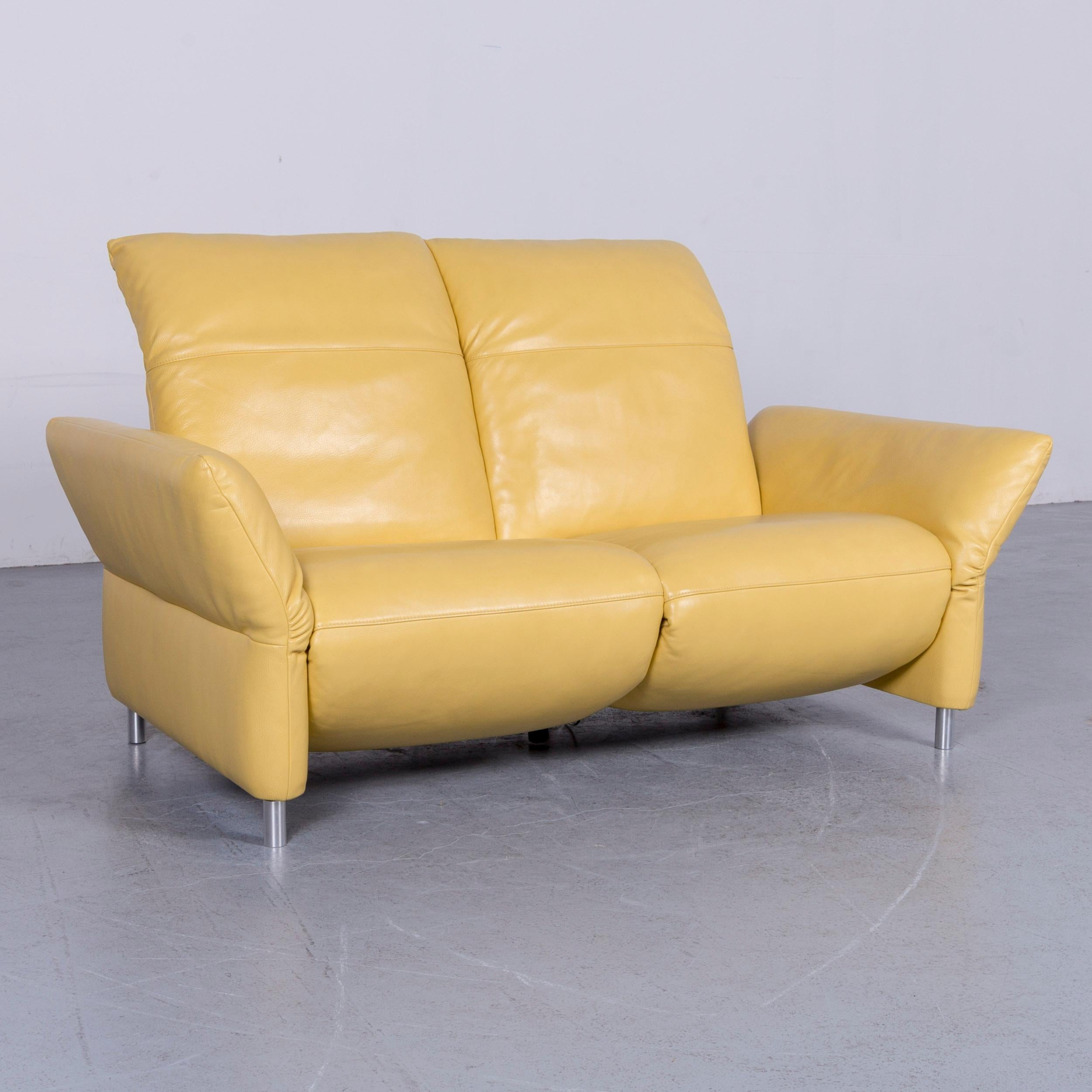 We bring to you a Koinor Elena designer two-seat sofa yellow leather function couch.