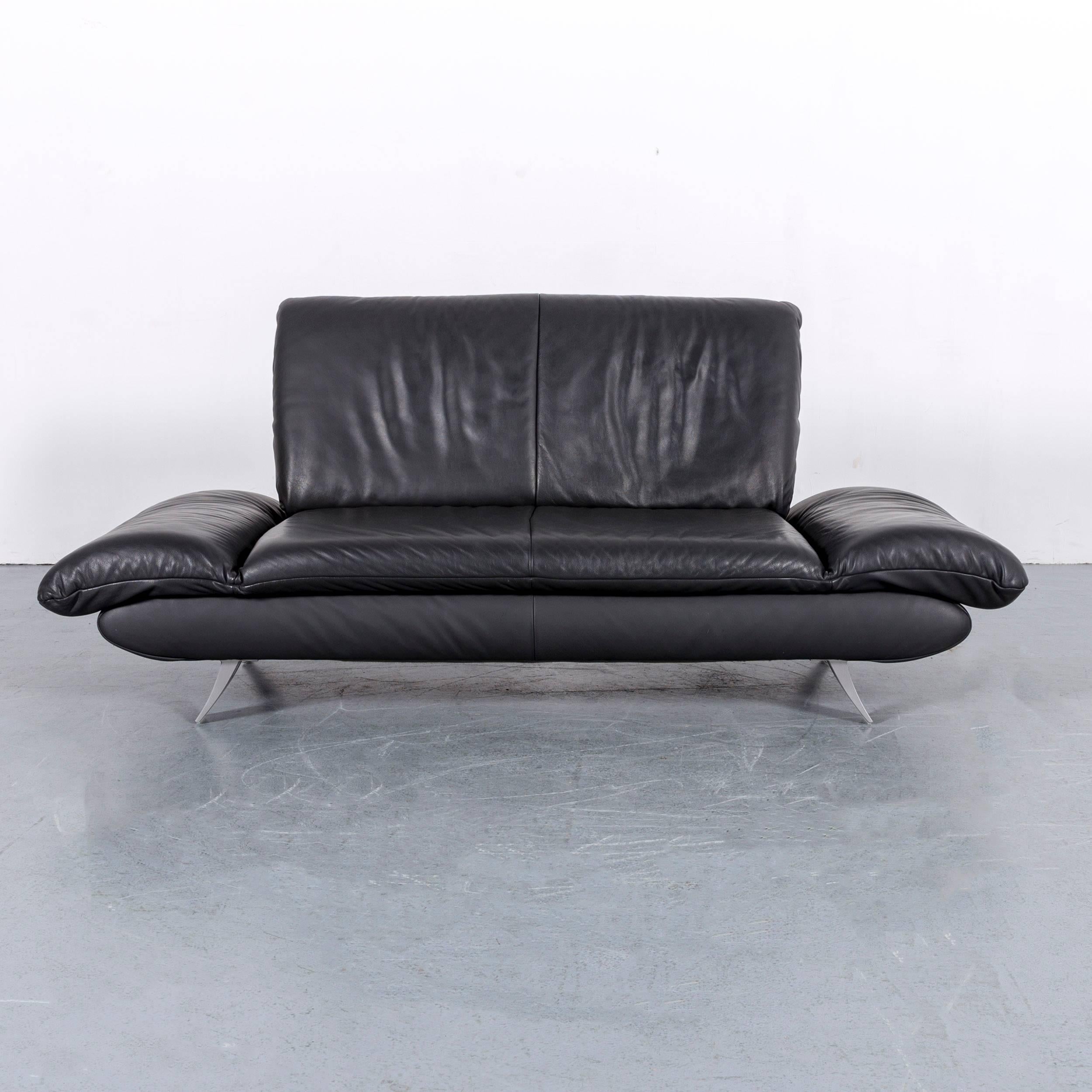 We bring to you an Koinor Rossini designer leather sofa in grey with functions two-seat.















 