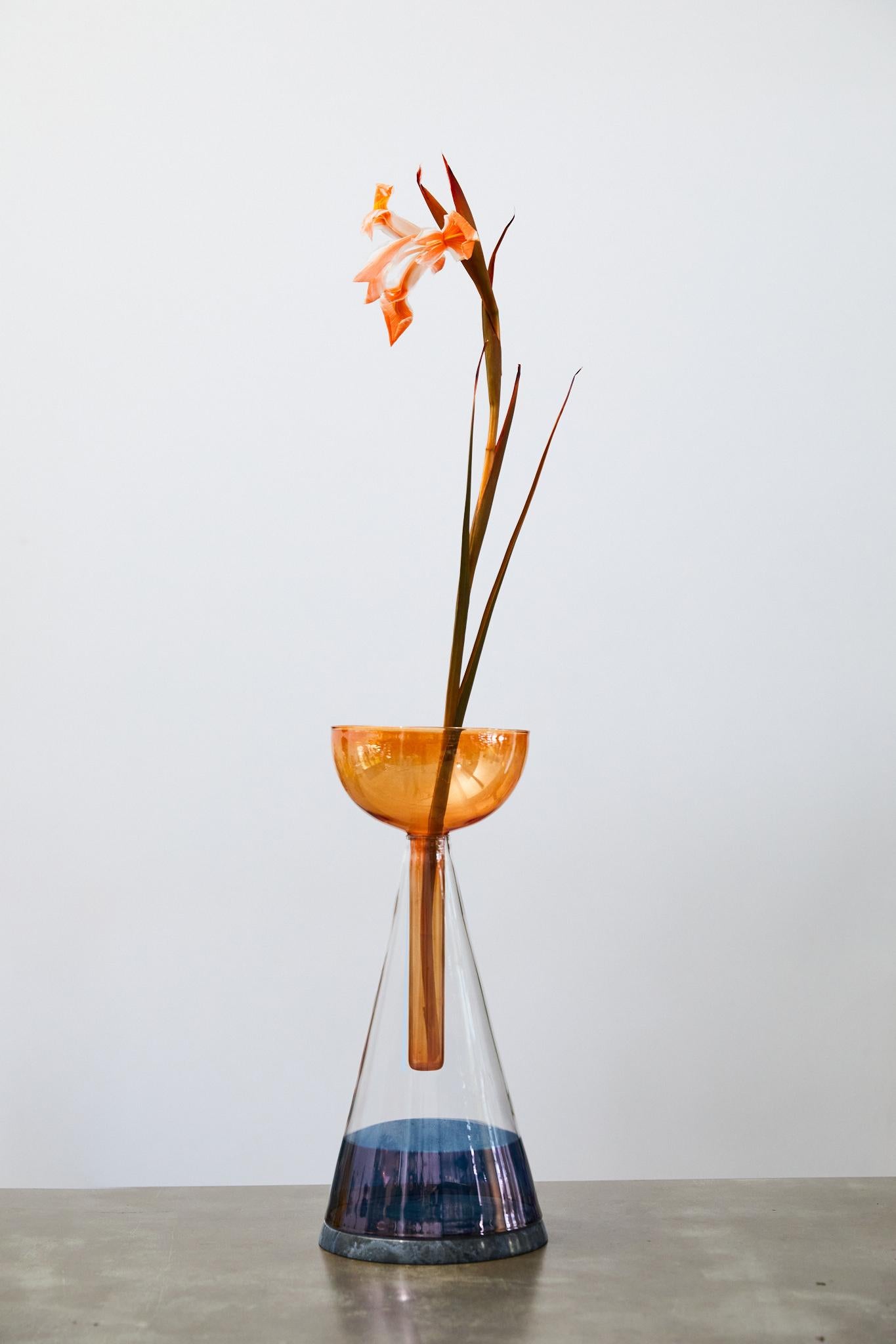 Koke’ Vase by Laboratorio
Dimensions: Ø 15 x H 35 cm.
Materials: Hand-painted blown glass and marble.

Available in different marble options. Prices may vary. All our lamps can be wired according to each country. If sold to the USA it will be wired