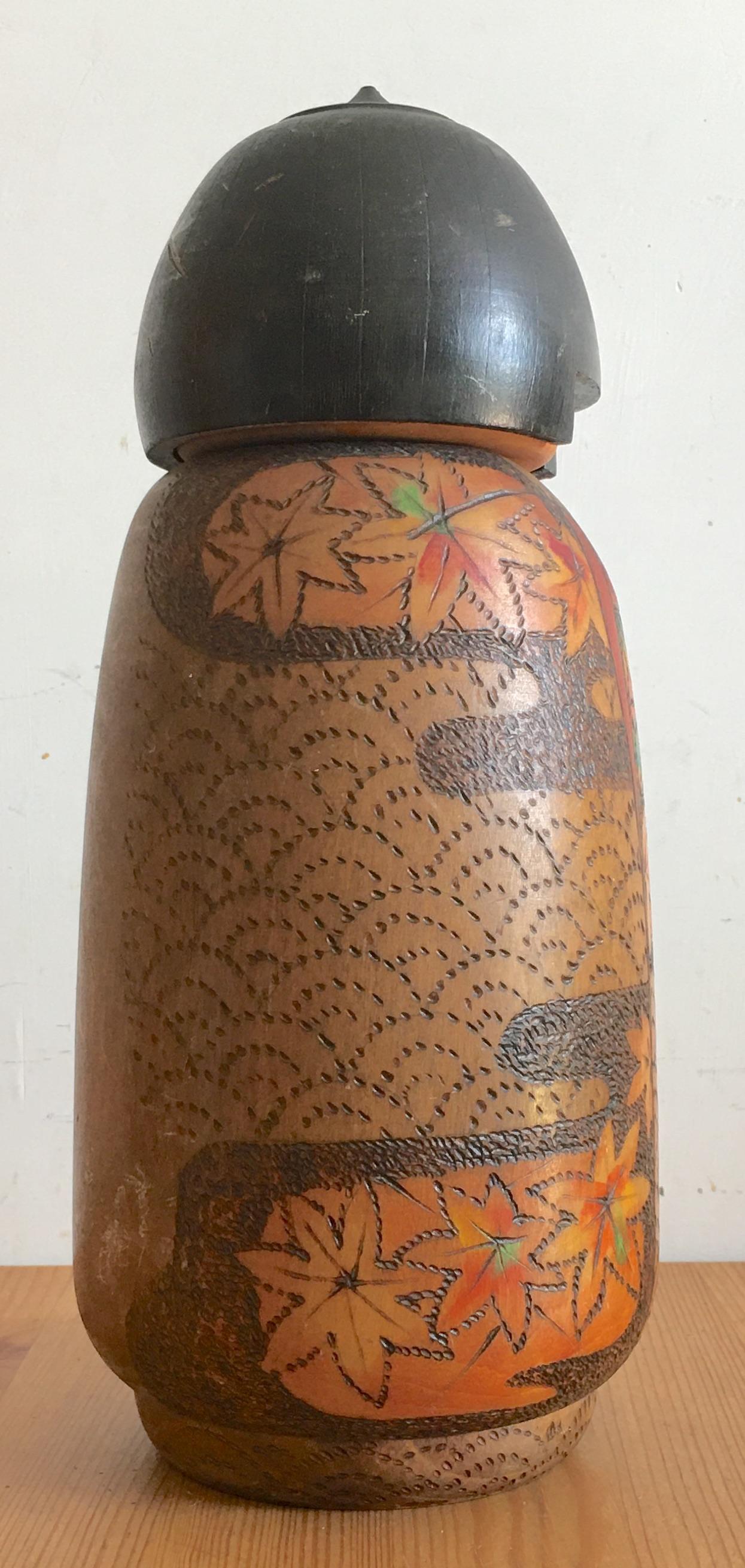 It is easily recognizable as the work of the famous Kobayashi. His Kokeshi are often heavy and large round pieces like this one. He is a Kokeshi Artisan Prime Minister Award winner and his kokeshi are collected all over the world. Kobayashi was born