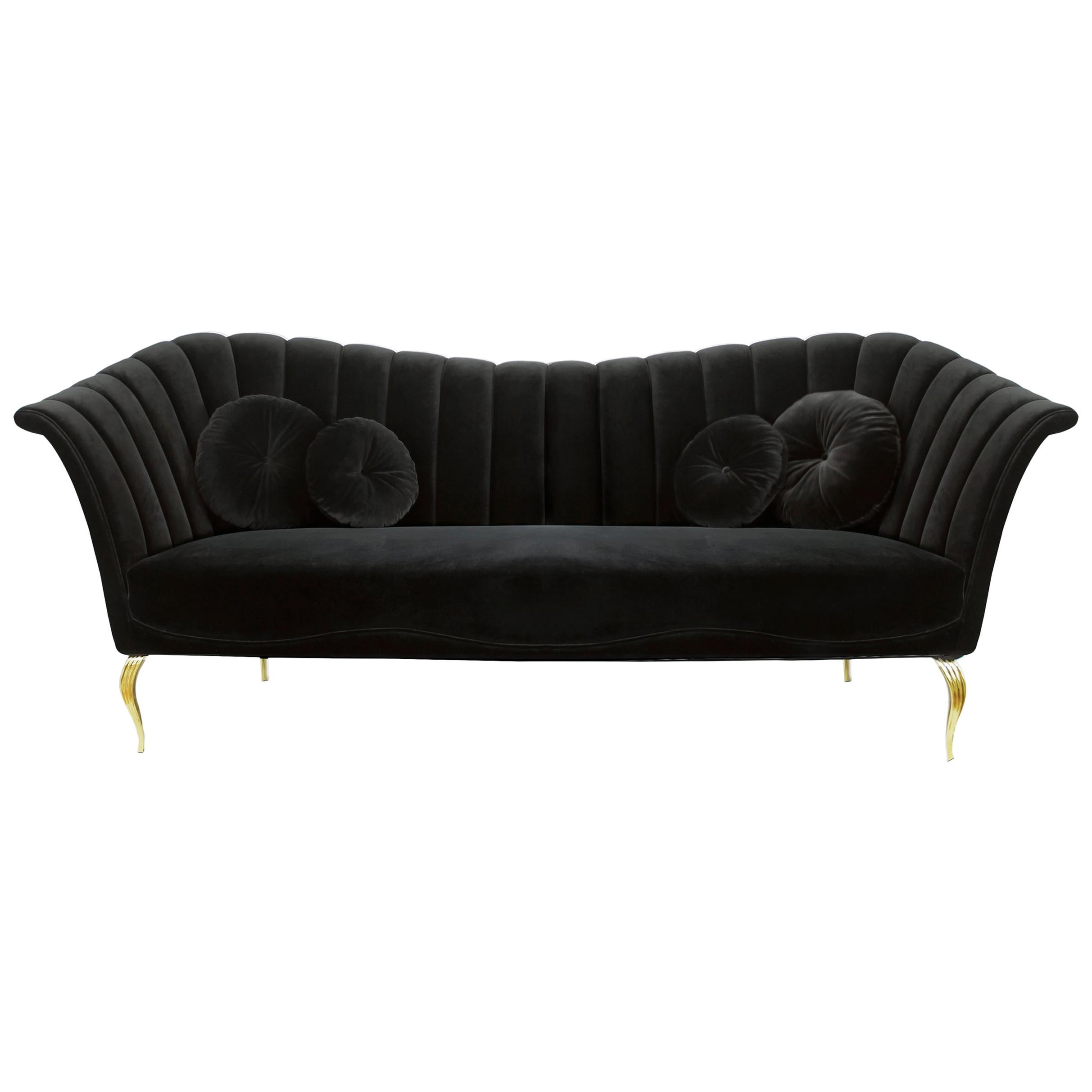 Flirty and unpredictable like a modern woman, the Caprichosa’s voluptuous sofa design mimics a woman’s most desirable curves. Fitted like a little black dress in delicious upholstery fabric and resting on dainty brass feet.

Options
Upholstery: