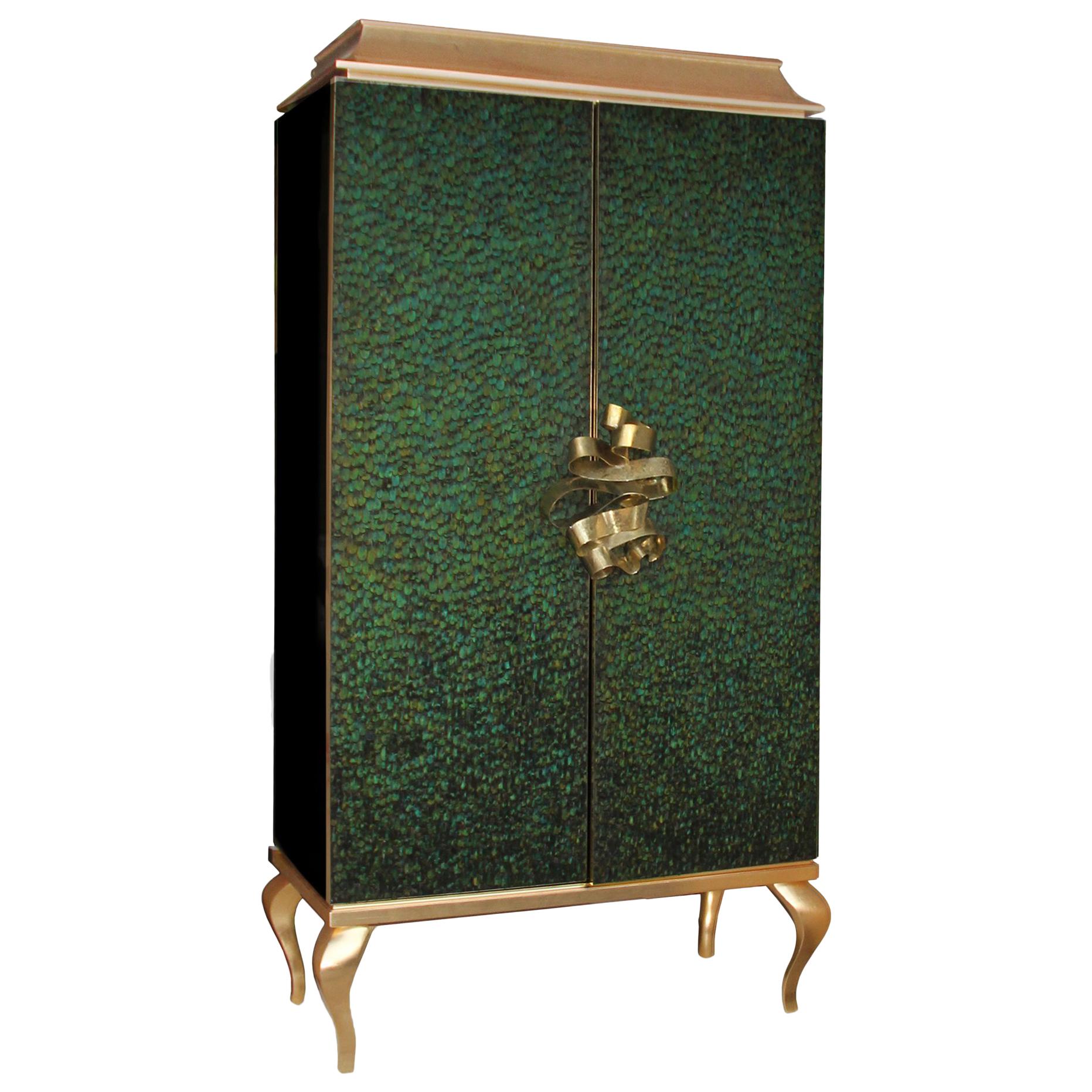 This utterly desirable double door pagoda top armoire is covered in delicate, individually placed natural feathers. An exquisite metal ribbon opens the doors to a lavish interior graced with four drawers and two adjustable shelves. The top and base