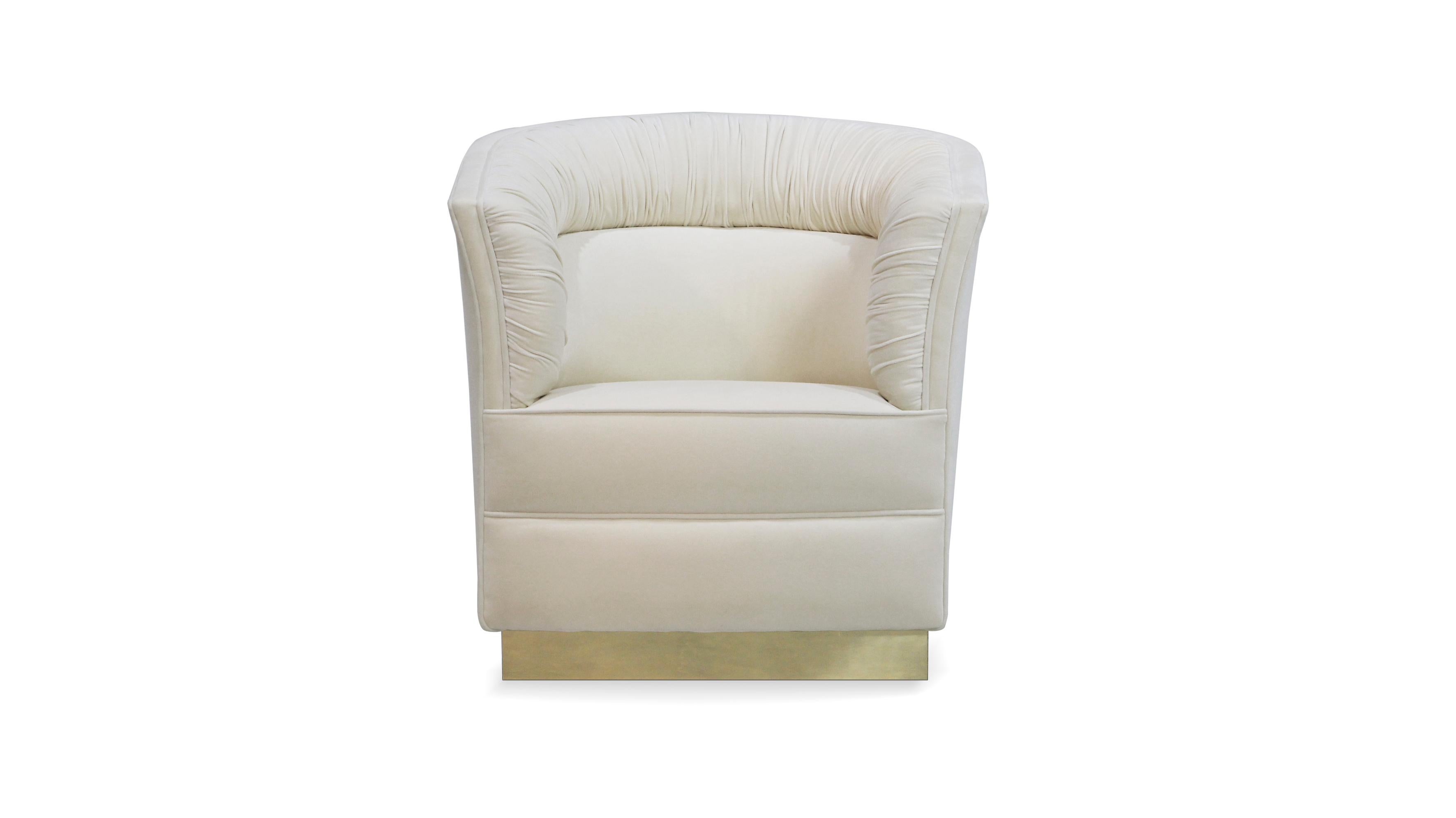 Lean back and be held by the soft fabric arms of the Lovely chair. Her curves softly unfold like a Lily in bloom contrasted by her trendy square base, wrapped with a posh metal band.

Options
Upholstery: Available in any fabric from the Koket