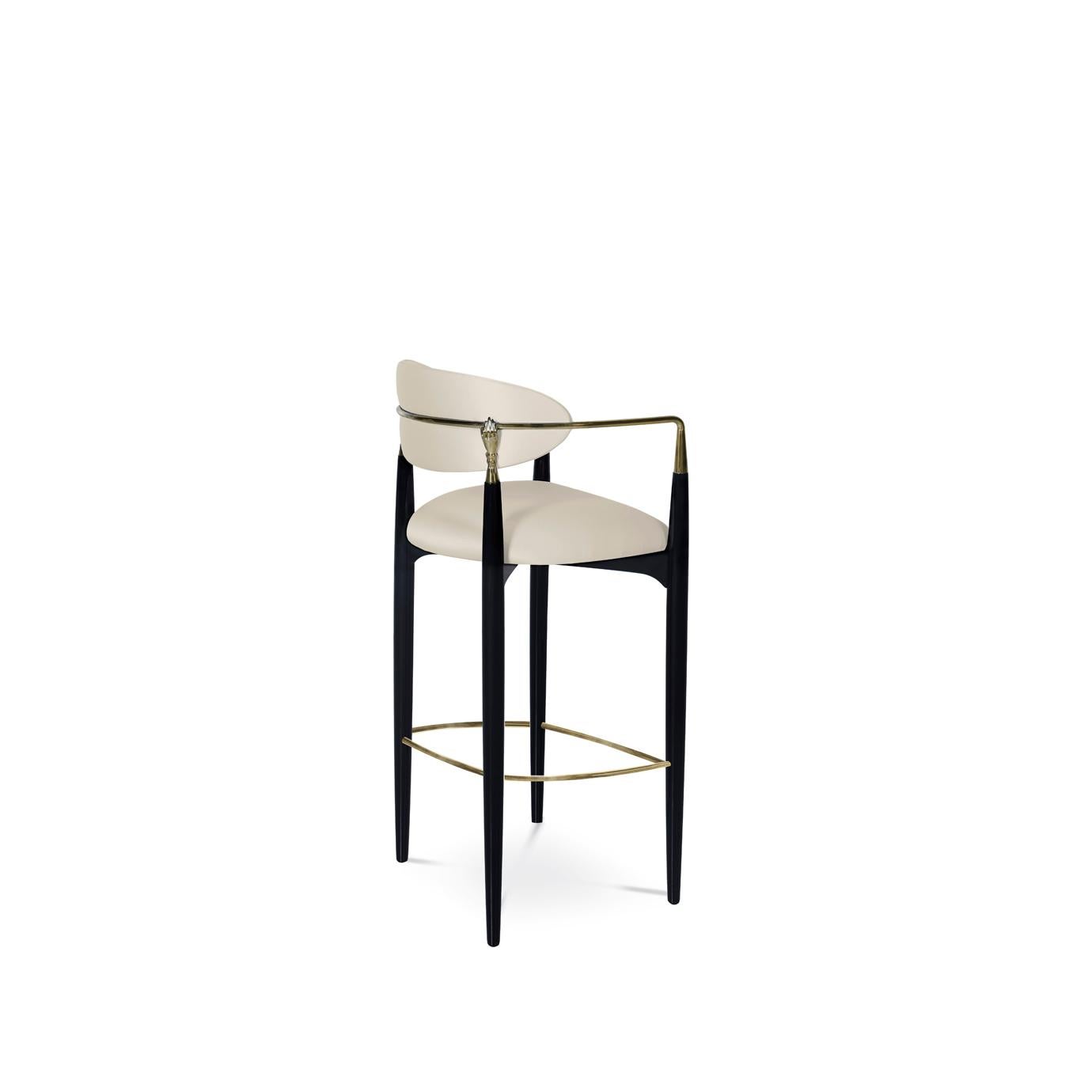 Try not to get handsy with the flirty and modern design of the Nahe´ma bar stool. Her sweet seat and contemporary detached back are bound by a metal and lacquer frame complete with two hand details, insistently grasping at your
