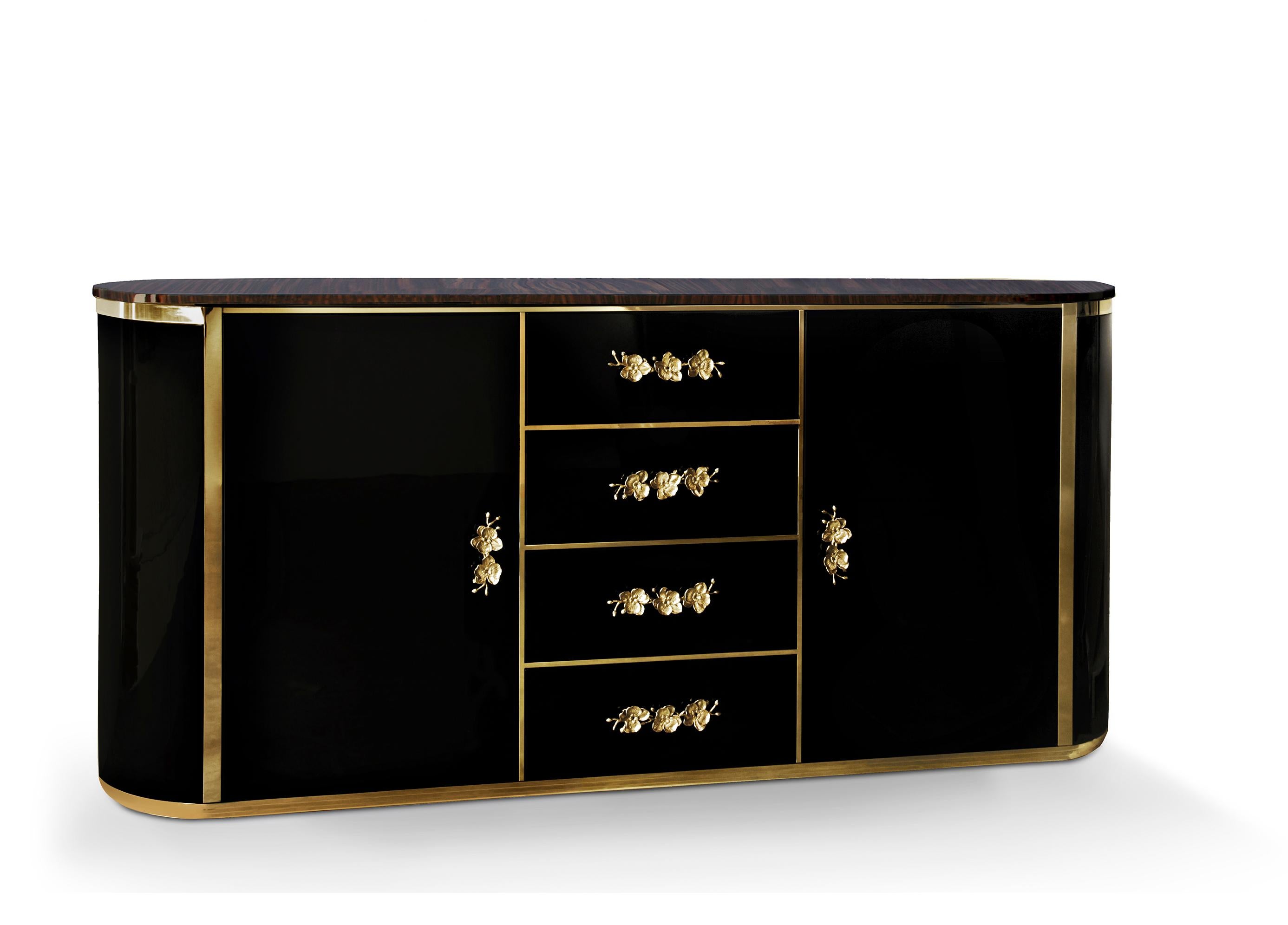 The vintage-inspired drama of this elegant chest captures the essence of haute style. Sensuous curves and subtle gilt makes the Orchidea an irresistible choice. The oval body is covered in a high gloss lacquer with charming orchid handles adorning