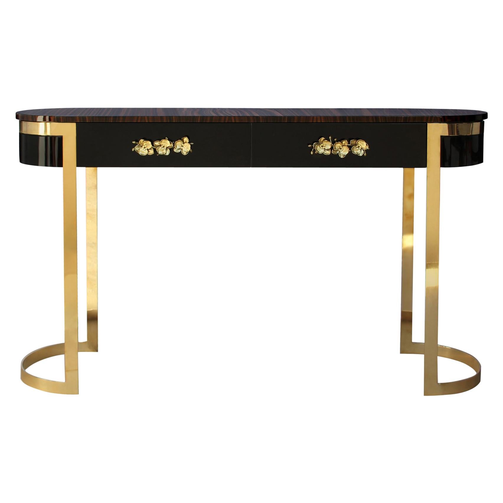 The vintage-inspired drama of this elegant console captures the essence of haute style. Sensuous curves and subtle gilt makes the Orchidea an irresistible choice. The oval body is covered in a high gloss lacquer with charming orchid handles adorning