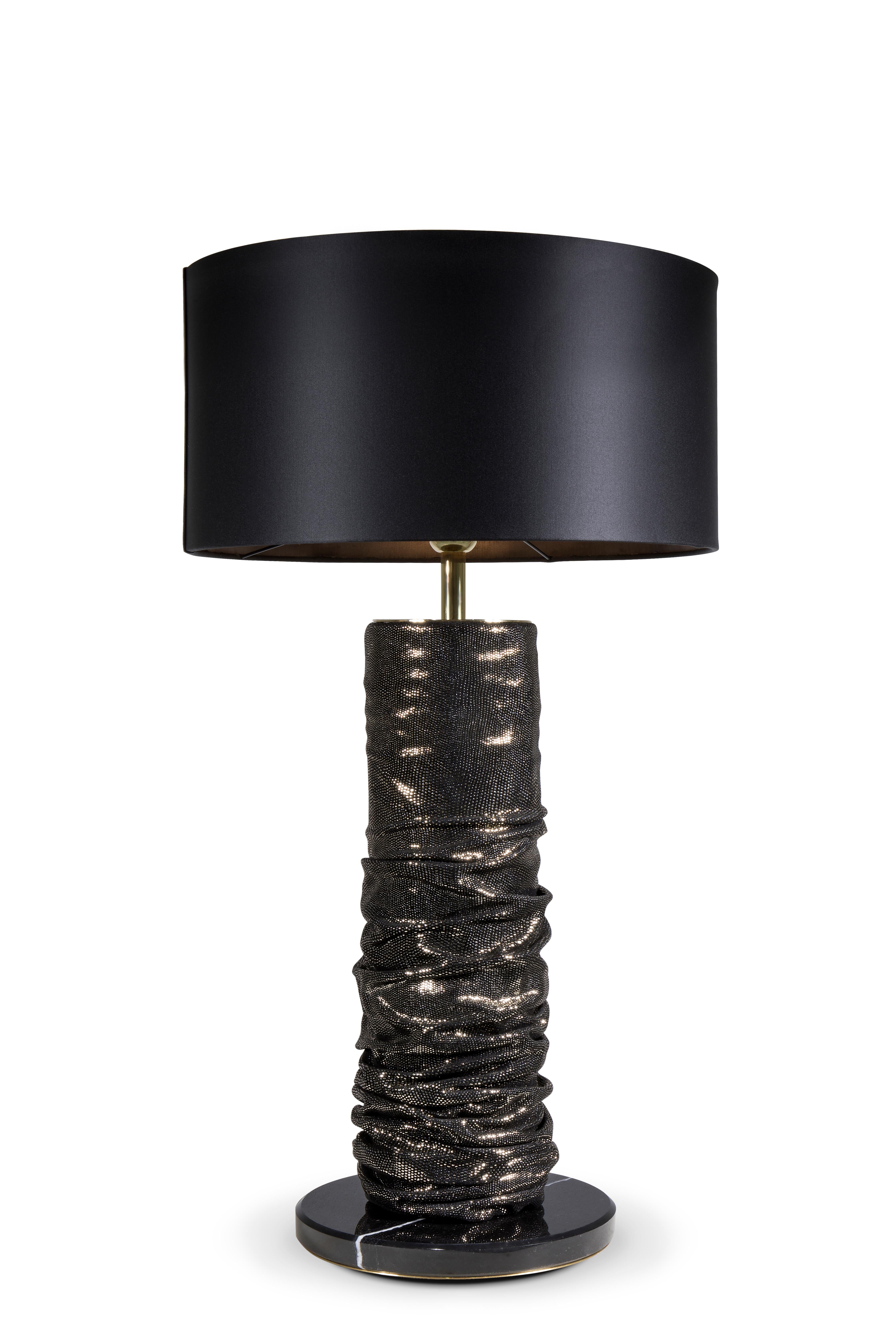 The curvaceous Ruche lamp is a flash back to the 1980s slouch sleeve and boot. Its gathered leather-like shape glistens under its light.

Base: Polished Nero marquina marble
Body: Pixel Gold leather from Koket textiles collection
Lamp shade: Opulent