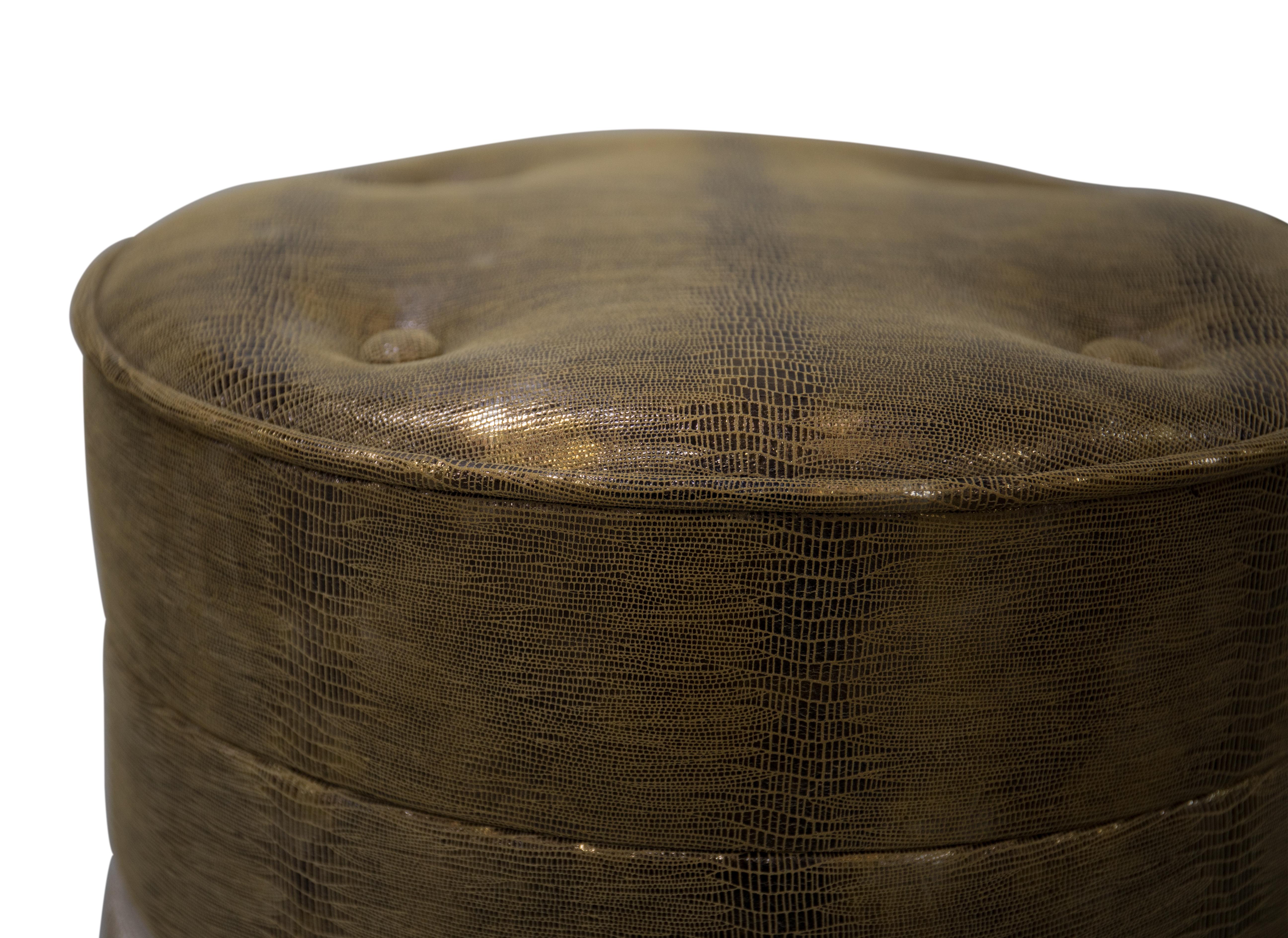 Each of these fashionable pouf stools feature their own unique combination of contrasting materials. One of a trio of Koket pouf designs, the tailored button tufted seats, polish brass belts and flowing fringed skirts make this lovely lady the