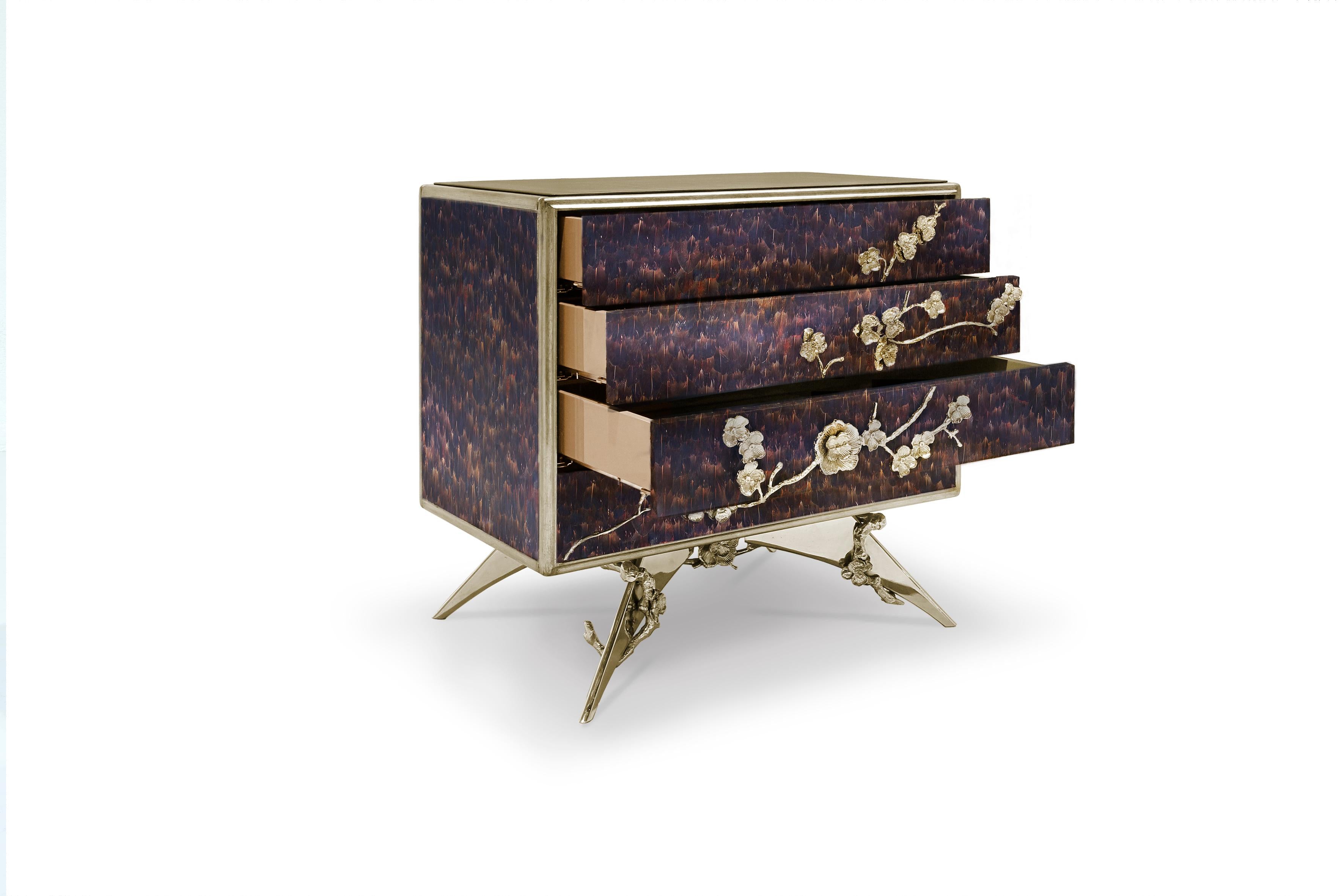 There is a sense of reveal and conceal as Koket takes a beautiful nightstand in high gloss lacquer and adorns it in metal organic lace, revealing a mesmerizing hint of what lies beneath. Four drawers embellished with organic hardware.

Structure: