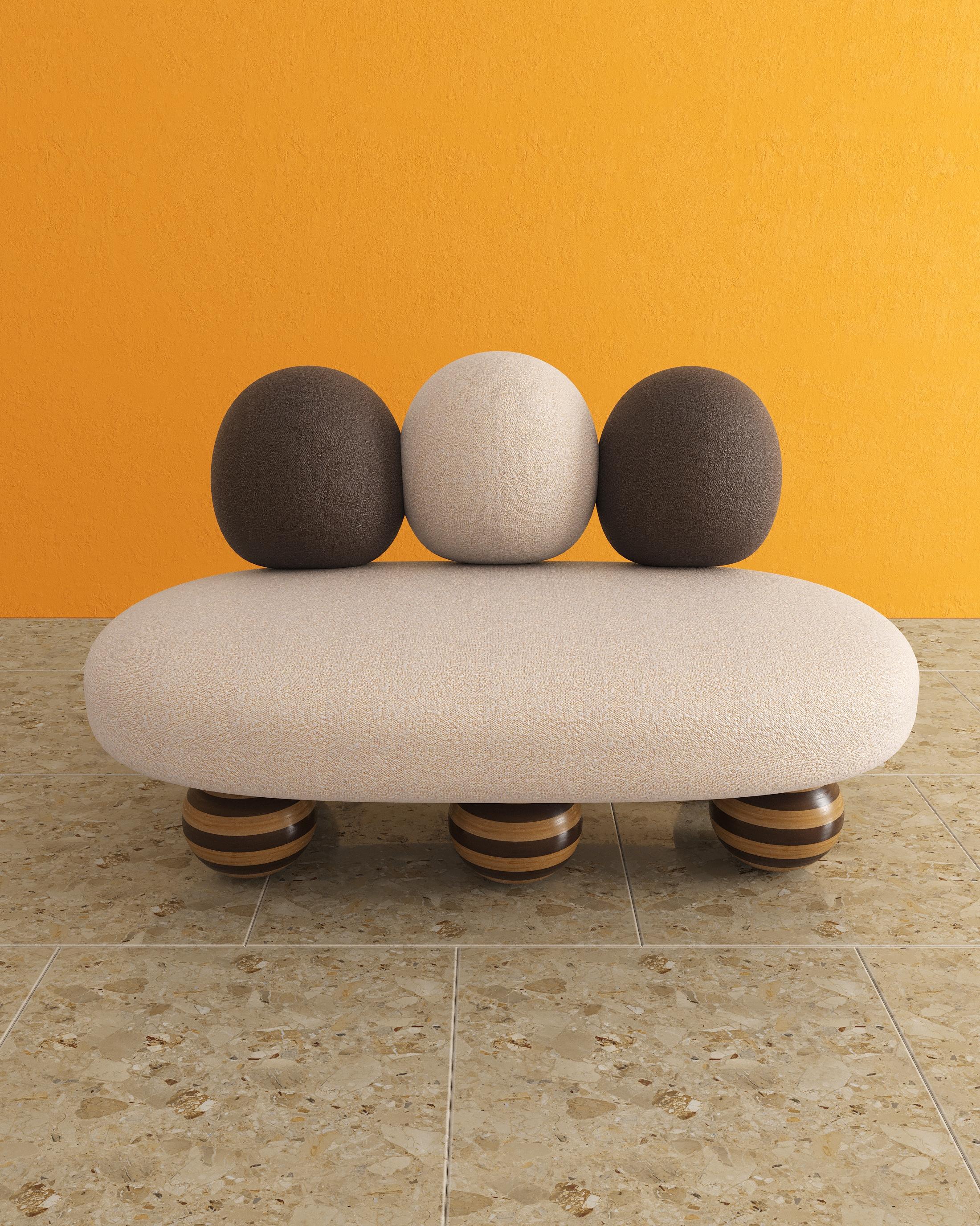 Introducing the Momo sofa - an avant garde design. This piece is designed with earth tones and shapes in mind. The Momo Sofa has six oakwood legs, ensuring stability and durability. Polythene foam padding is used for extra comfort, upholstered in e