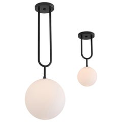 Koko, a Modern Brass Pendant Light with Satin Globe Shade in Graphite Finish