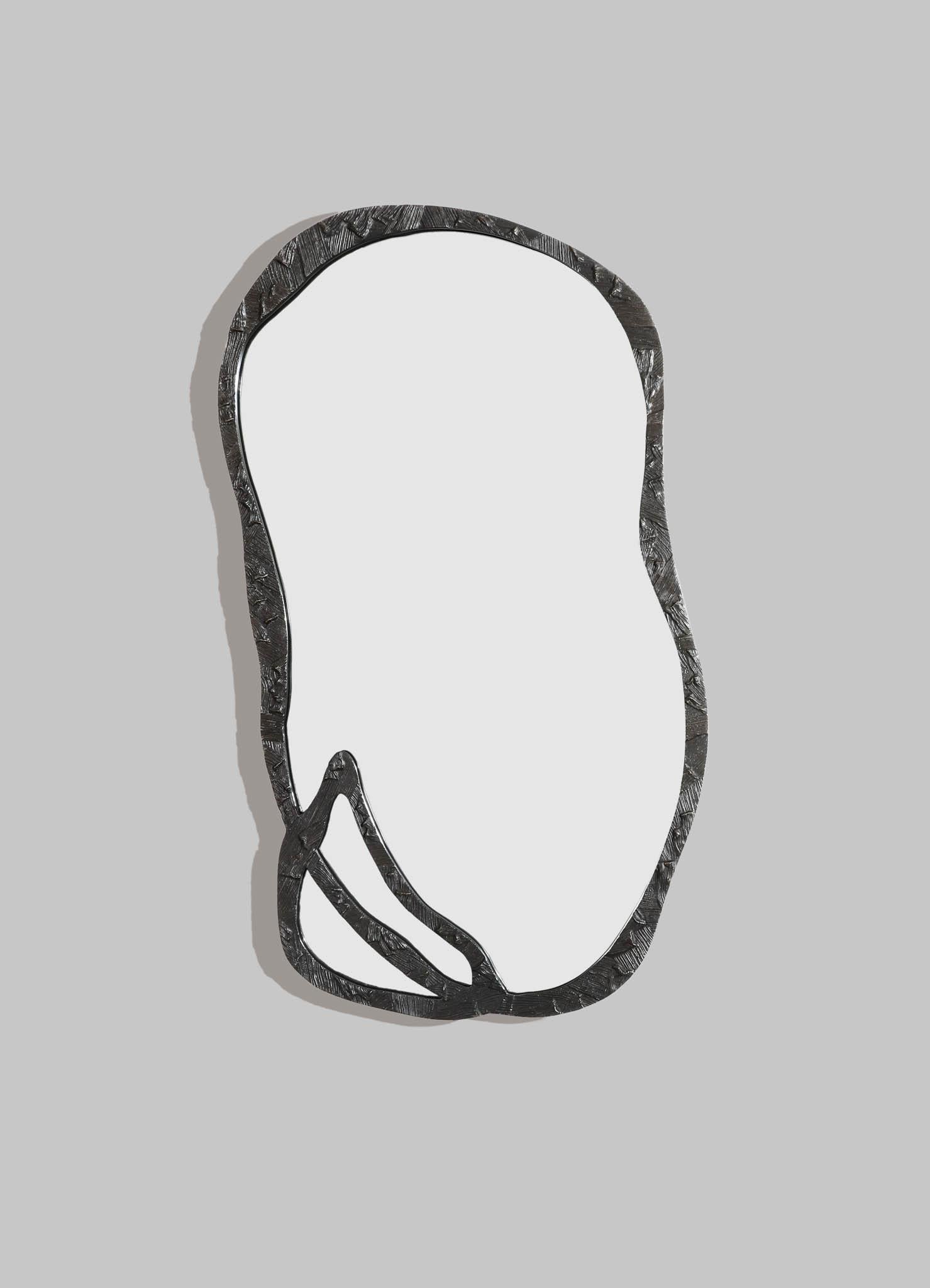 Kolam Bronze Mirror Tall in Brass, Viya by Vikram Goyal

Poetic patterns conspire to weave an enchanting tapestry, a lyrical reinterpretation of Kolam—the ancient ritual of adornment that graces the thresholds of Indian homes. Entryways become