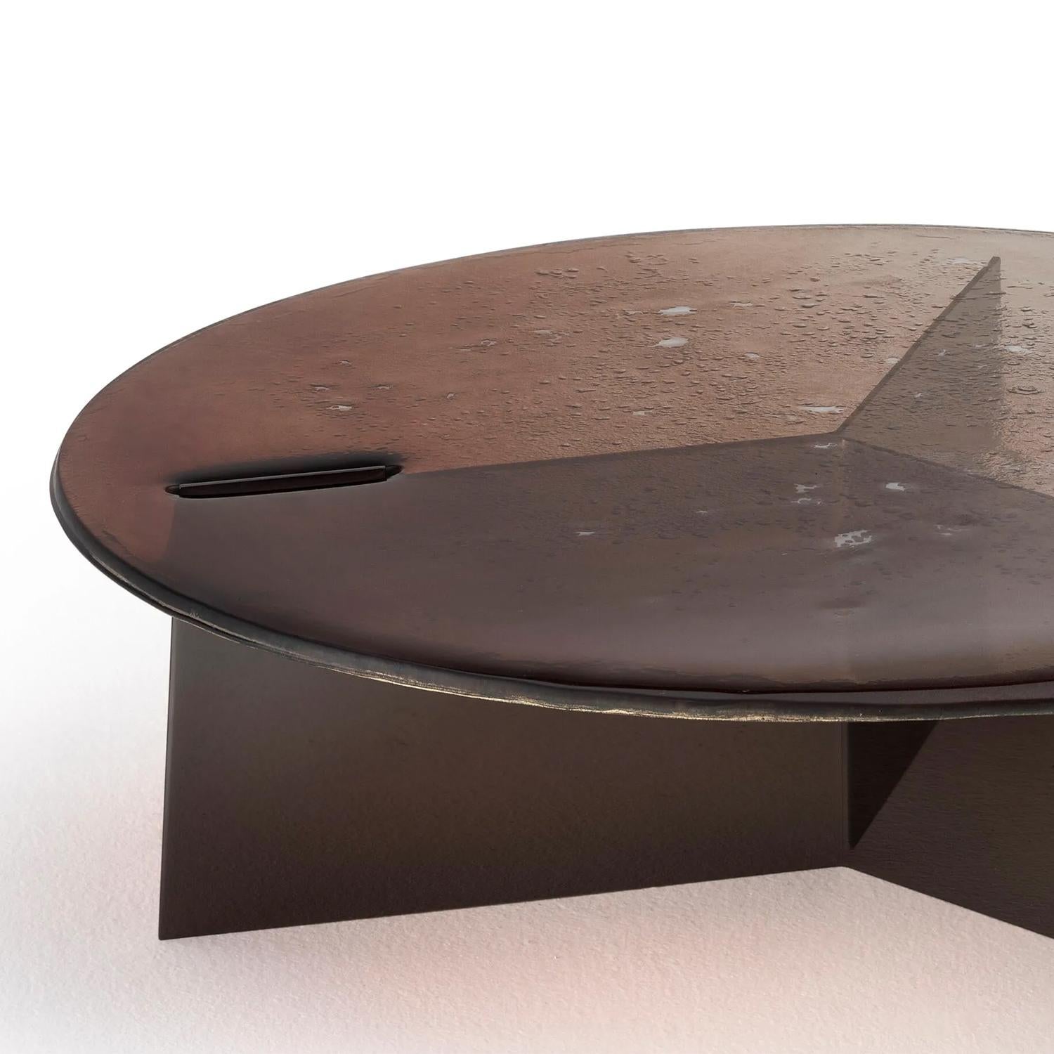 Coffee Table Kollam Large with baked glass in 2 layers with
irregular edges top. With gradient paint from bronze
to transparent with partial silvered back. With sheet
structure in polished nickel finish.
Also available on request in Kollam Side