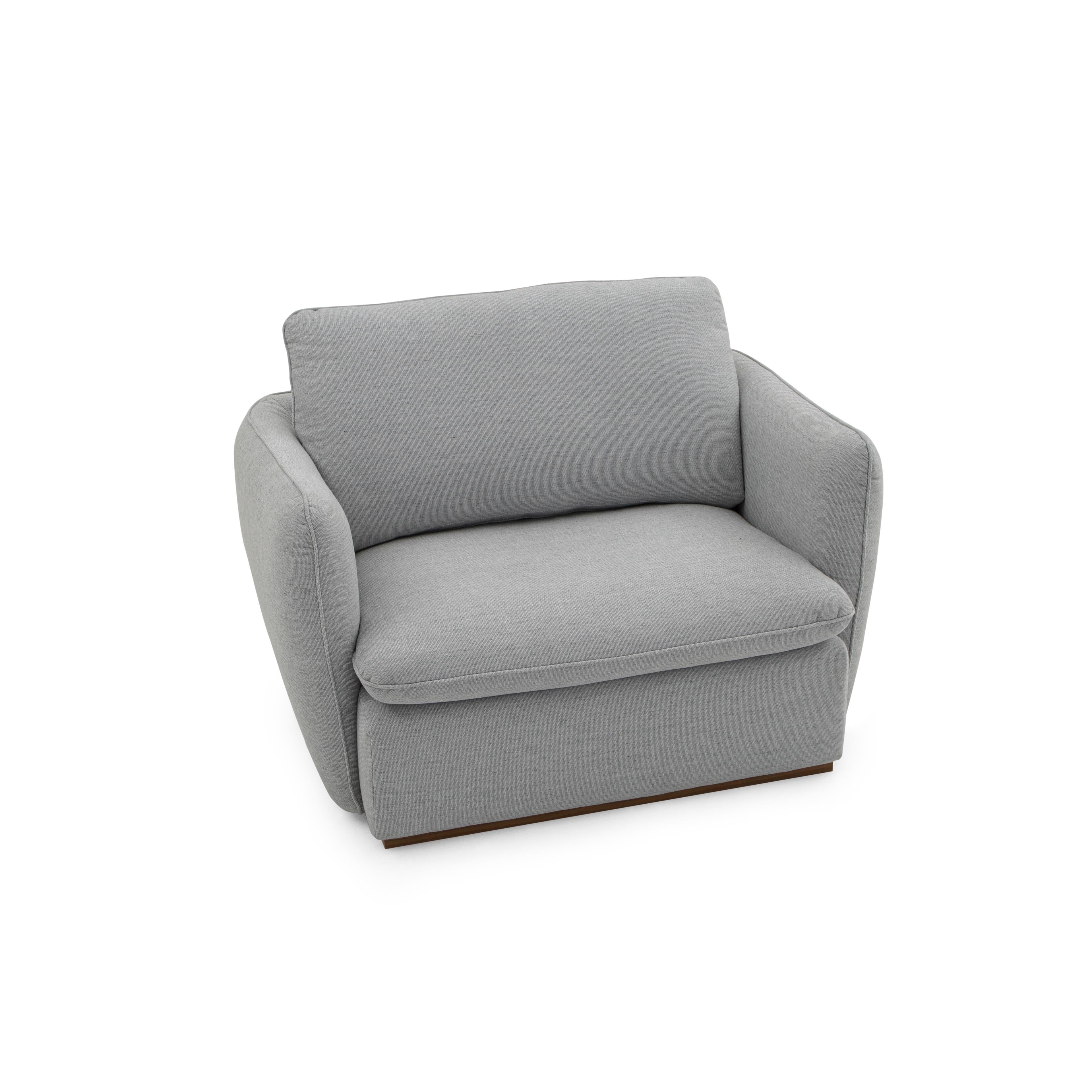 The Kolo armchair upholstered in a light gray fabric is here for you and your family. As relaxing as it looks, the actual sit is even better. Complete with padded arms, this armchair is the perfect complement to a room used by the entire family and