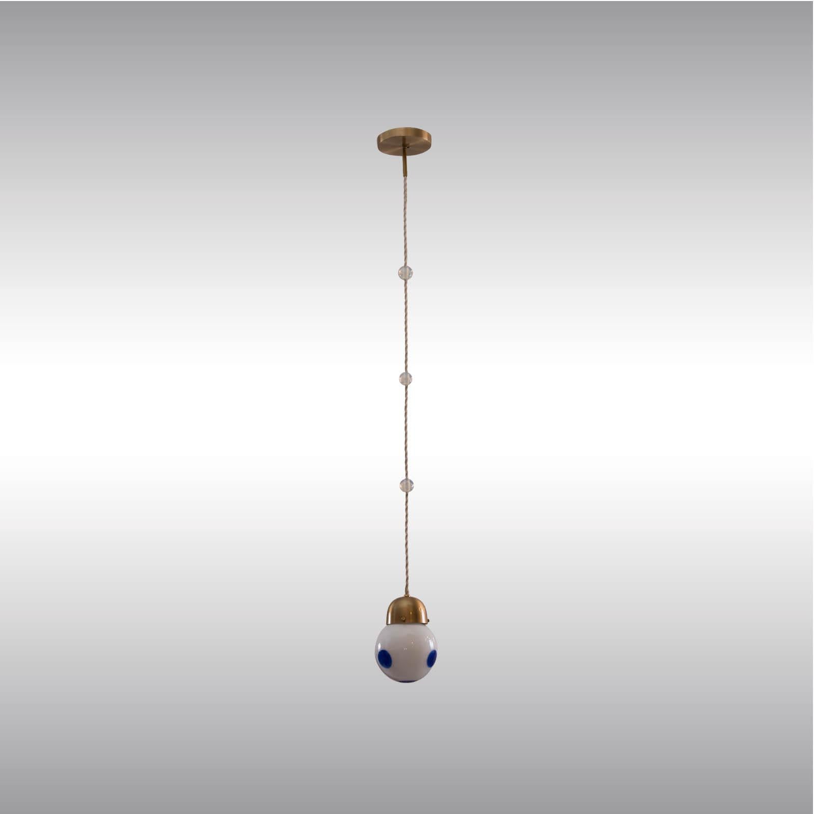 Single pendant often used by Josef Hoffmann as well as by Koloman Moser. We have the colored glasses in several versions and also the white opaline glasses.
Length is custom made!
Most components according to the UL regulations, with an additional