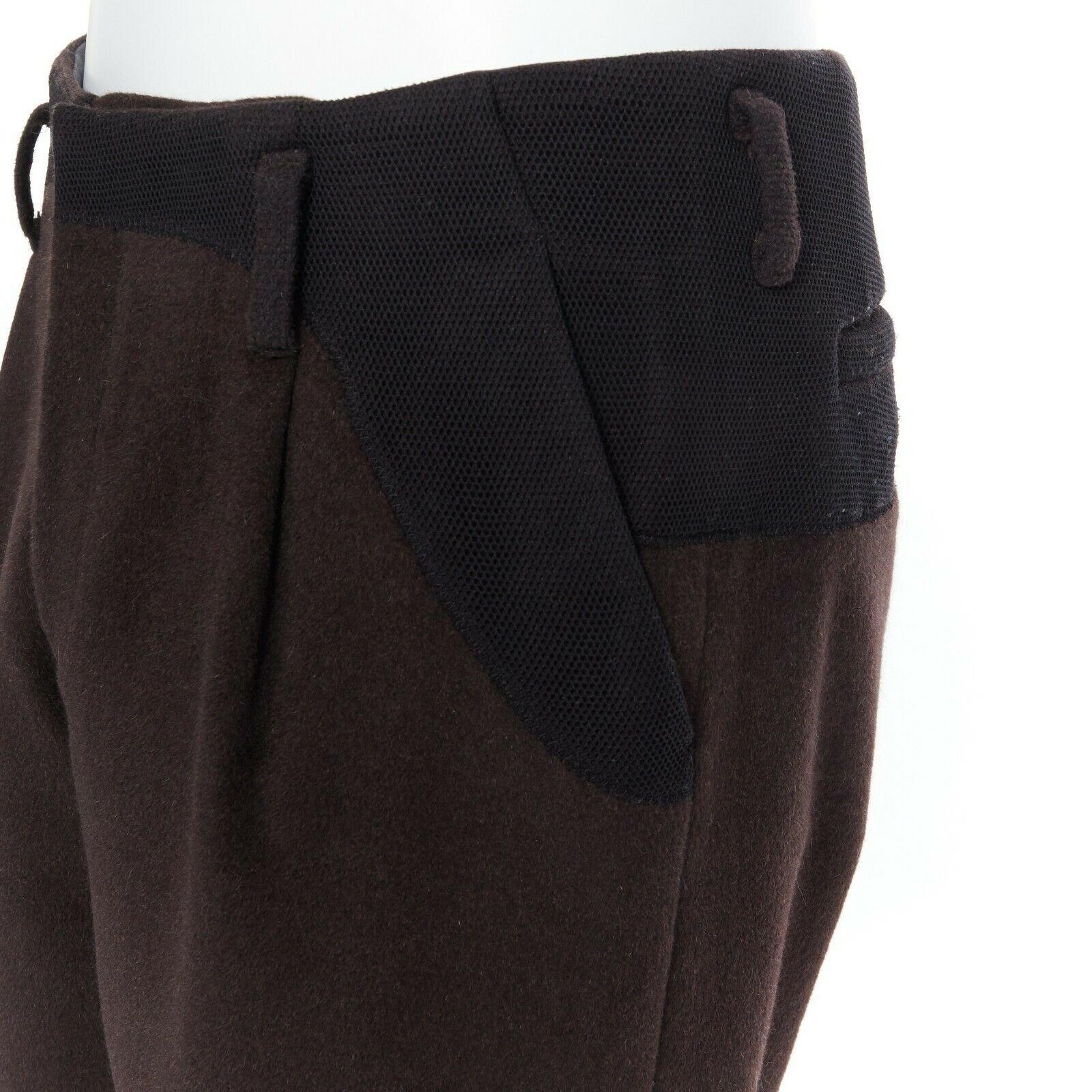 KOLOR men's dark brown mohair black mesh panels straight legged trousers pants 
Reference: ESWN/A00004 
Brand: Kolor 
Material: Unknown 
Color: Brown 
Pattern: Solid 
Closure: Zip 
Extra Detail: Straight legged trousers. Mesh panel at waist. 2 seam