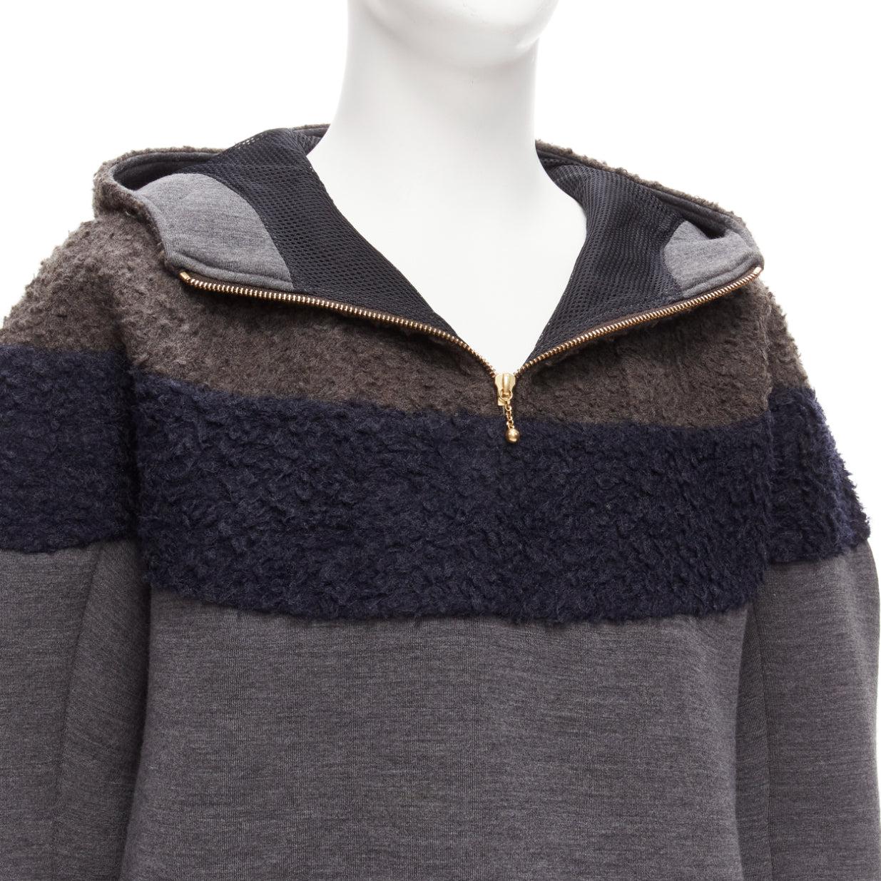 KOLOR grey navy wool blend colorblock dolman sleeve half zip knitted hoodie JP5 XXL
Reference: CAWG/A00258
Brand: Kolor
Material: Wool, Blend
Color: Navy, Grey
Pattern: Solid
Closure: Zip
Extra Details: Half zip closure at front. Mesh lining for