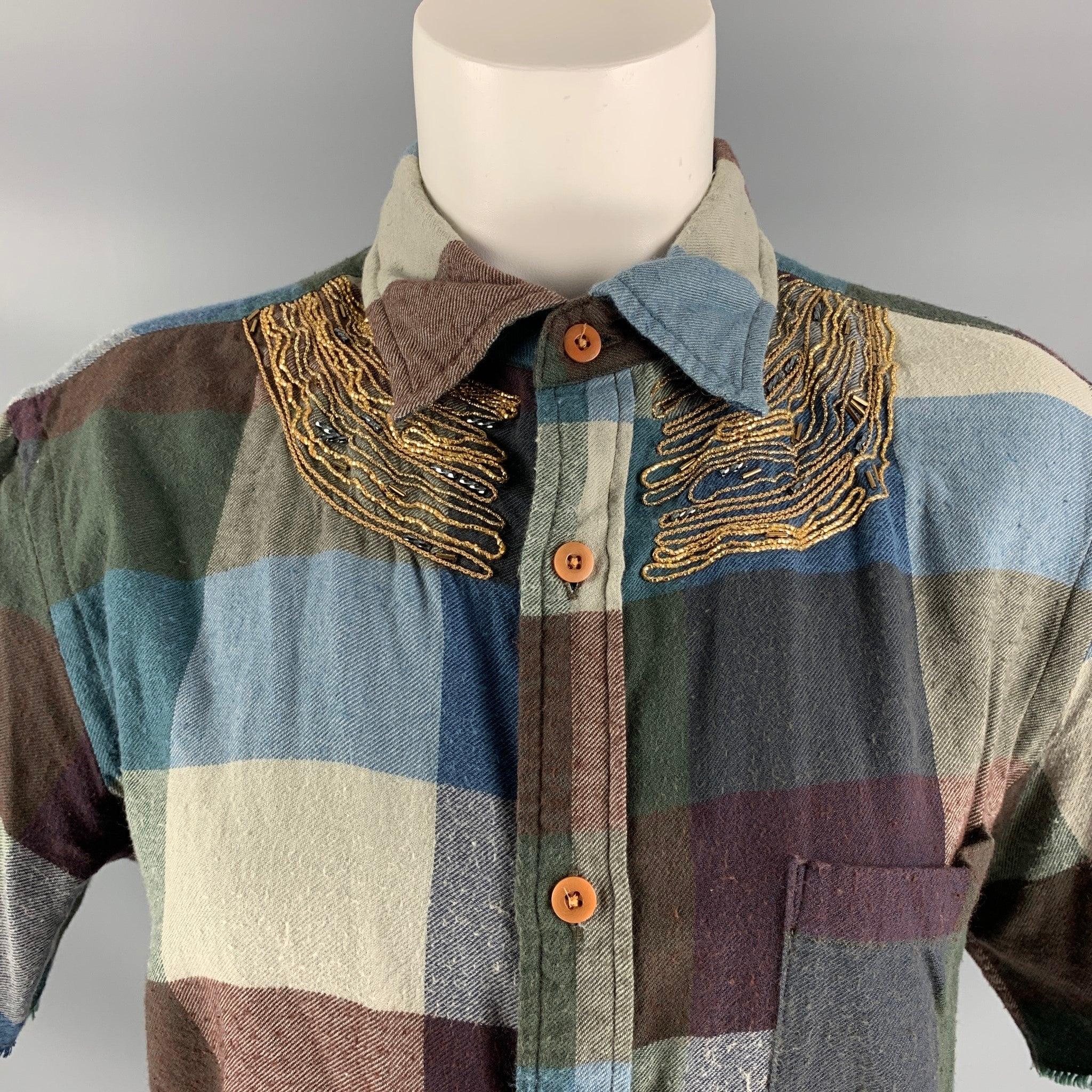 KOLOR short sleeve casual top comes in checkered cotton and cashmere fabric, straight collar and button down closure features a gold tone embroidery. Made in Japan.Very Good Pre-Owned Condition.  
 

 Marked:  3 
 

 Measurements: 
  
 Shoulder: