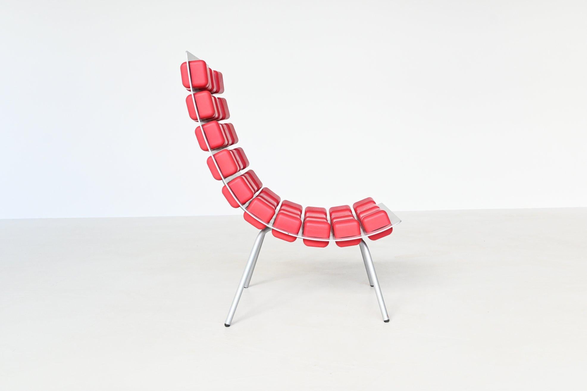 Beautiful shaped and rare lounge chair model Missy designed by Kombinat; Sven-Anwar Bibi, Mark Gutjahr and Jörg Zimmermann for Hidden, The Netherlands 2000. This chair is made of a curved aluminium shell which is punctuated with fist-sized cubes