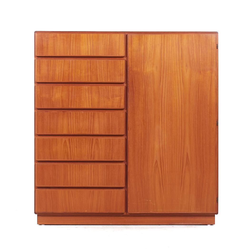 Komfort Mid Century Danish Teak Gentleman's Chest Highboy Dresser

This highboy measures: 48 wide x 18.75 deep x 51 inches high

All pieces of furniture can be had in what we call restored vintage condition. That means the piece is restored upon