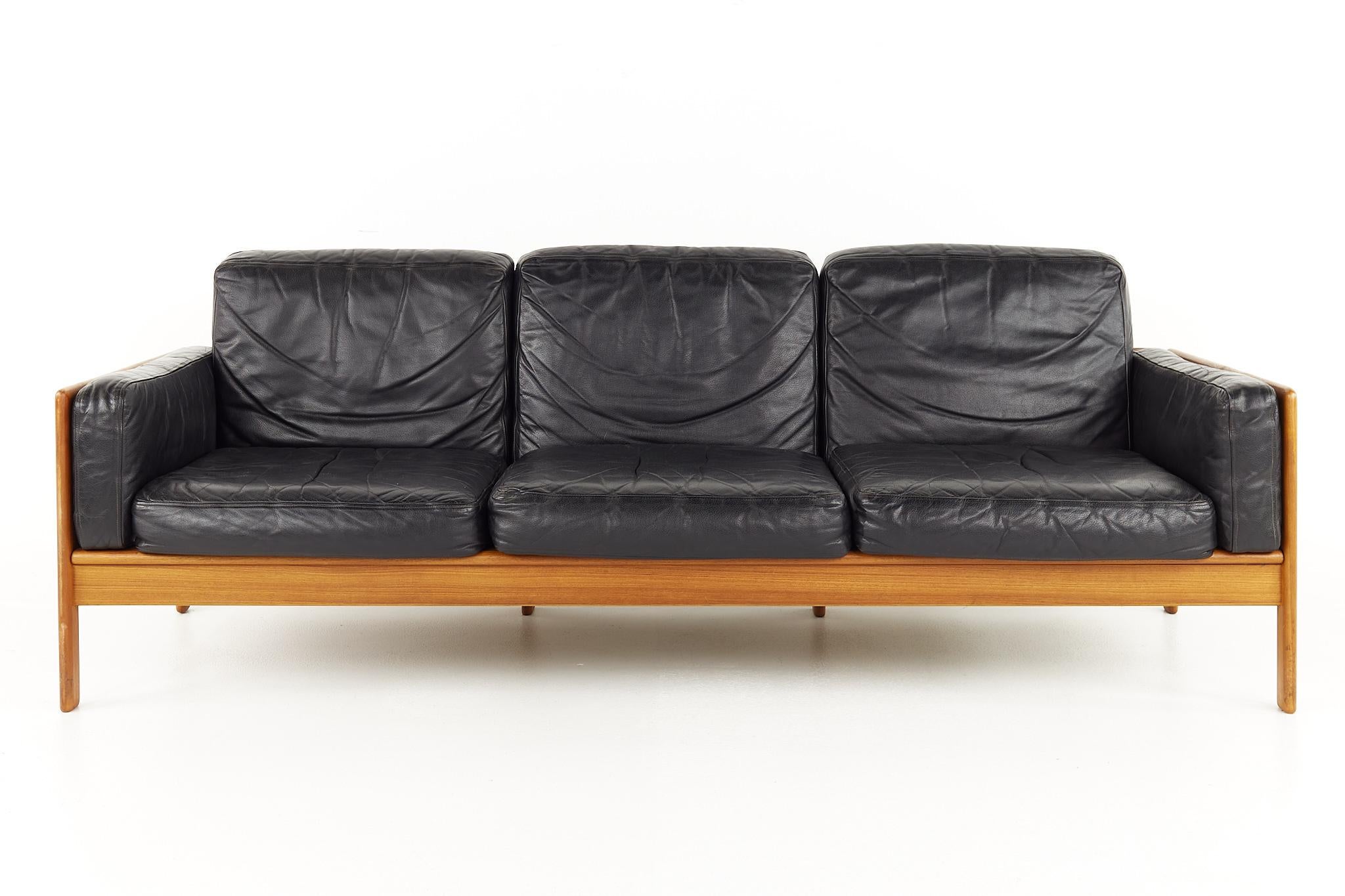 Komfort Mid century teak and leather sofa

The sofa measures: 74 wide x 28 deep x 28 high, with a seat height of 13.5 inches high and an arm height/chair clearance of 19.5 inches

All pieces of furniture can be had in what we call restored