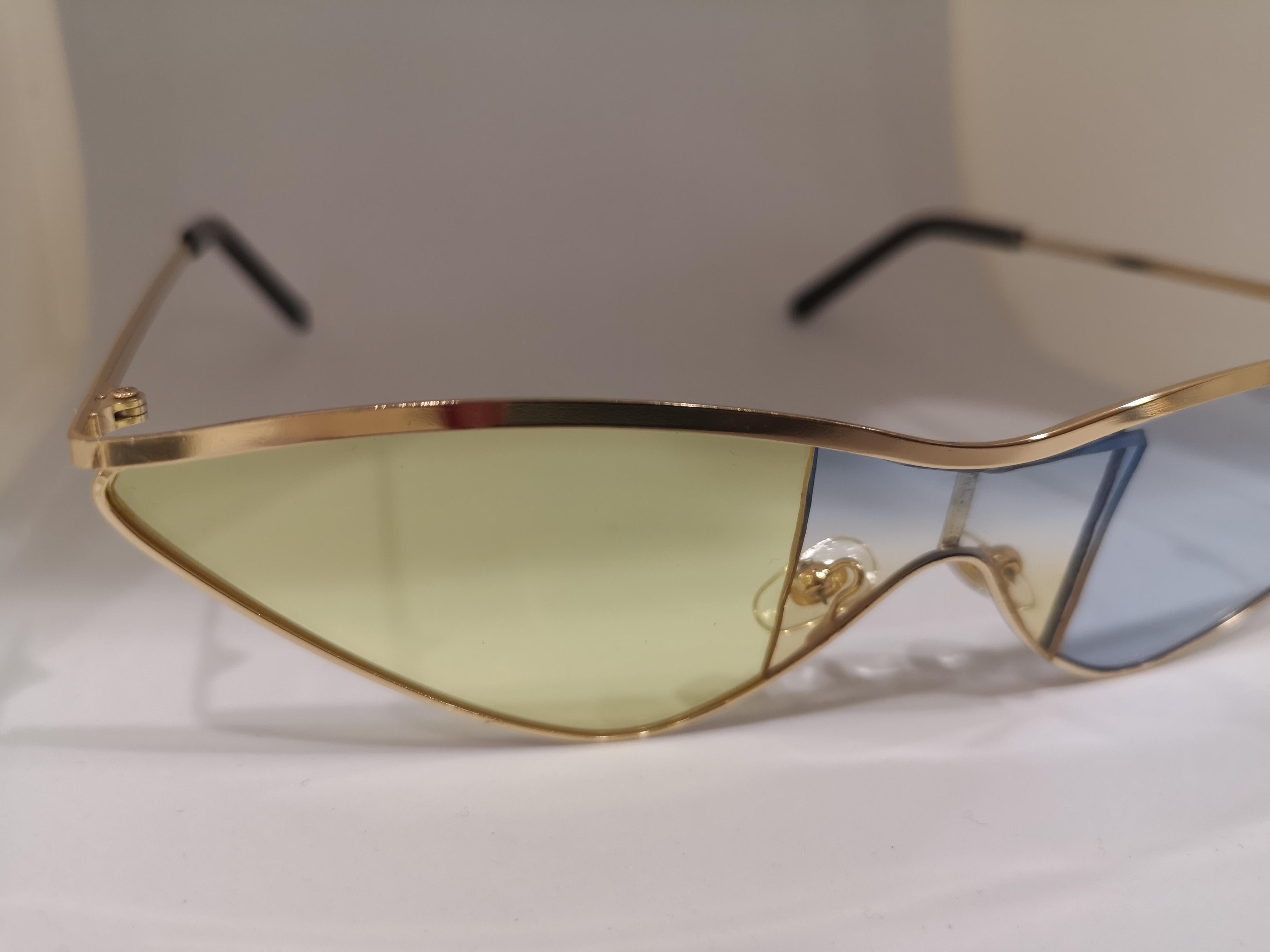 Gray Kommafa light blue yellow lens gold sunglasses