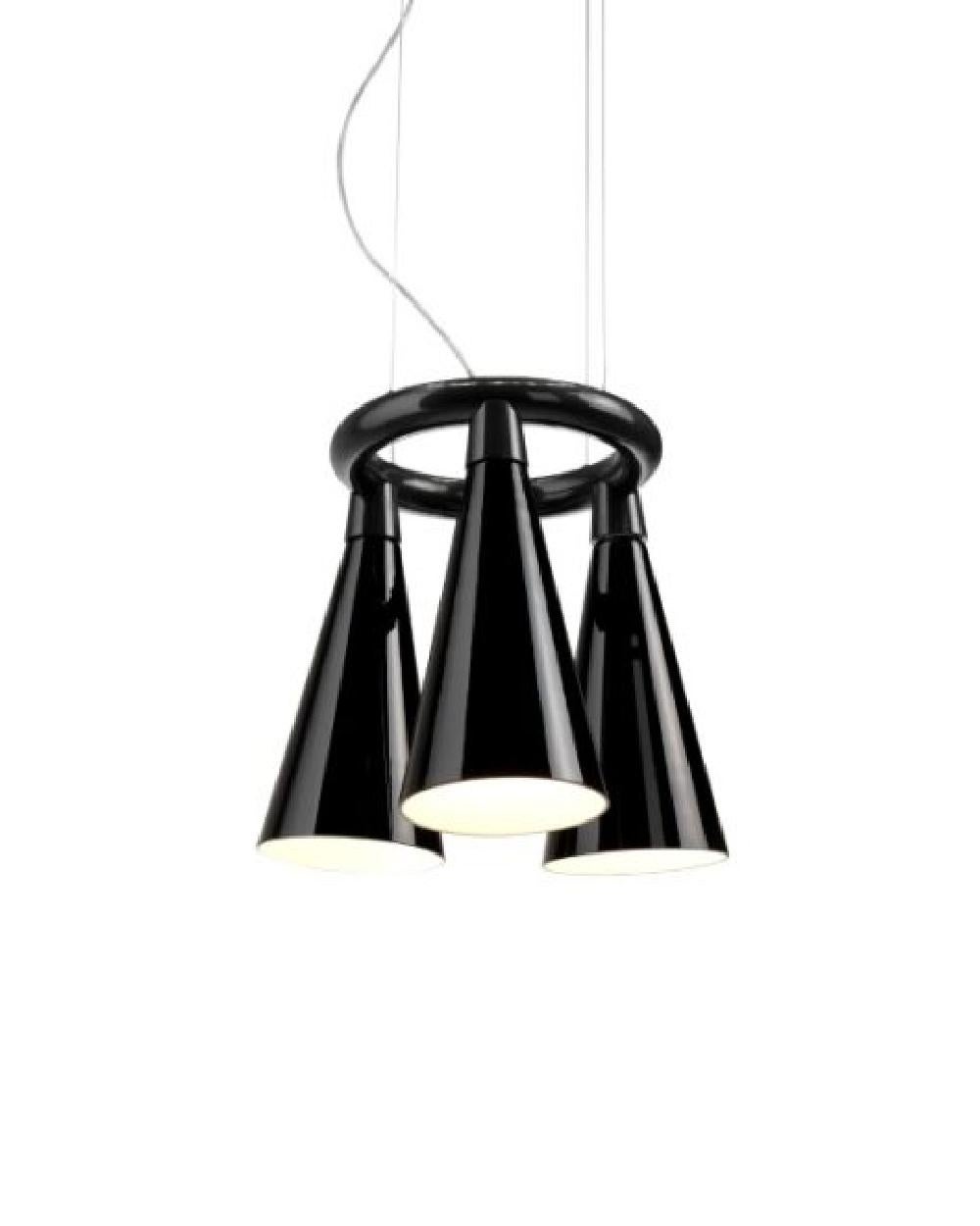 A chandelier reminiscent of pendulous bat colonies decorating tree branches and cave ceilings, Komori’s hand-blown distributed glass shades enclose individual lights, casting their illuminance downward. Bases can be connected to create a large