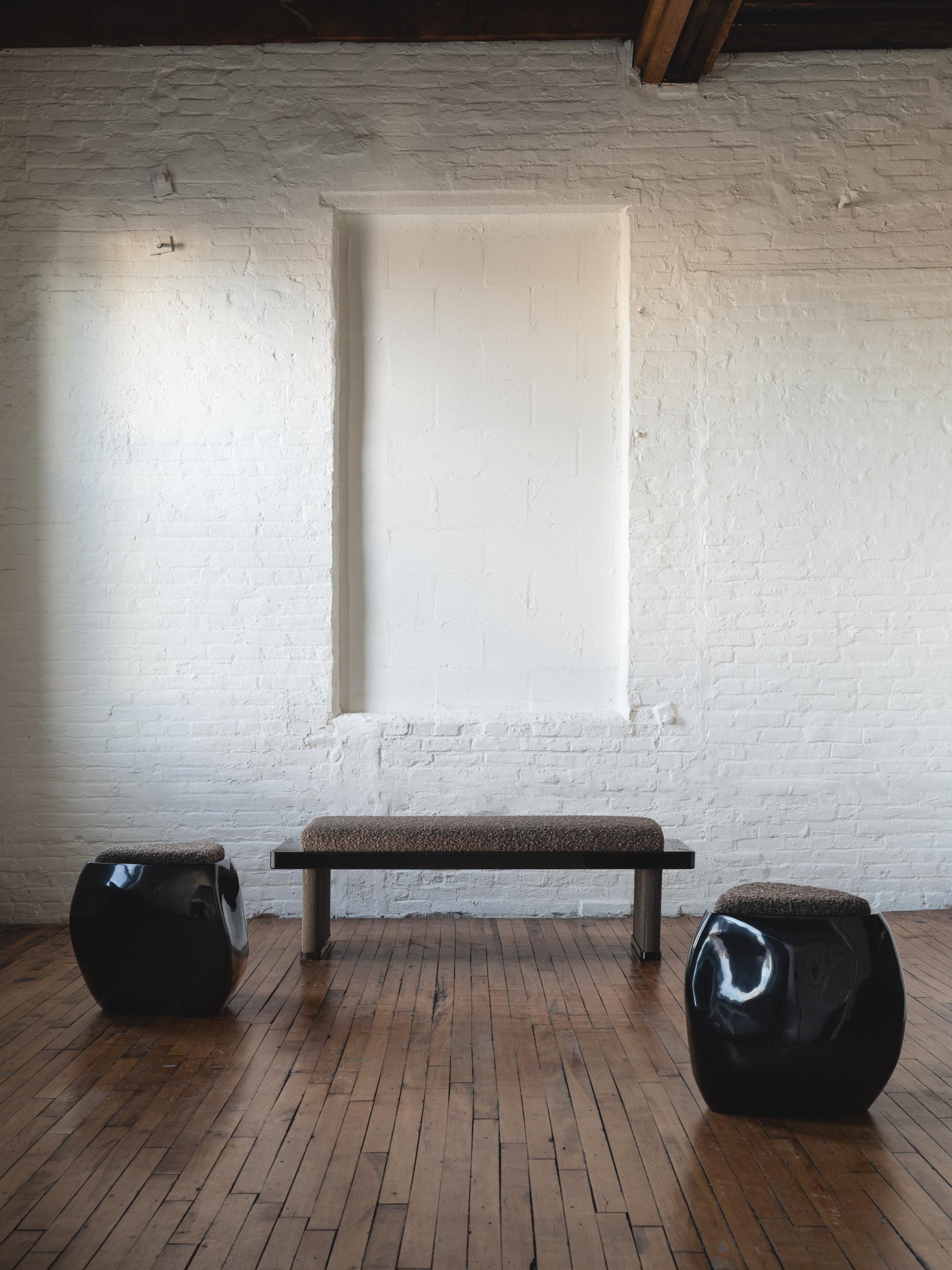 The Armor Bench features two elliptical legs cloaked in finished chainmail. Pulling from the intricate use of chainmail in Medieval armor, we reinterpret its materiality by creating a balance between the strength that the metal mesh evokes and the