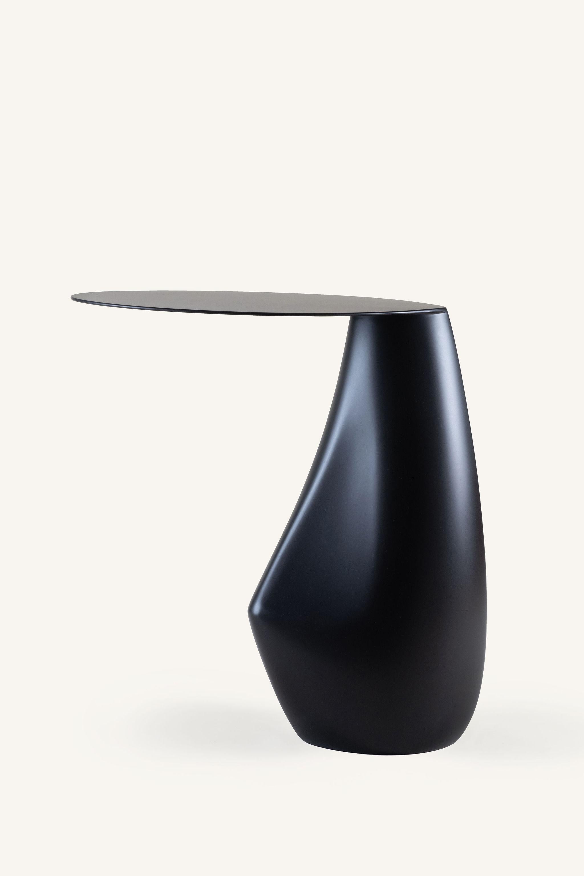 A signature piece from our stone collection, the expertly hand-sculpted dionis side table evokes the subtle curves and contours of tumbled stones shaped by the ocean. This side table presents as sculpture yet functions as a table. 

Also available