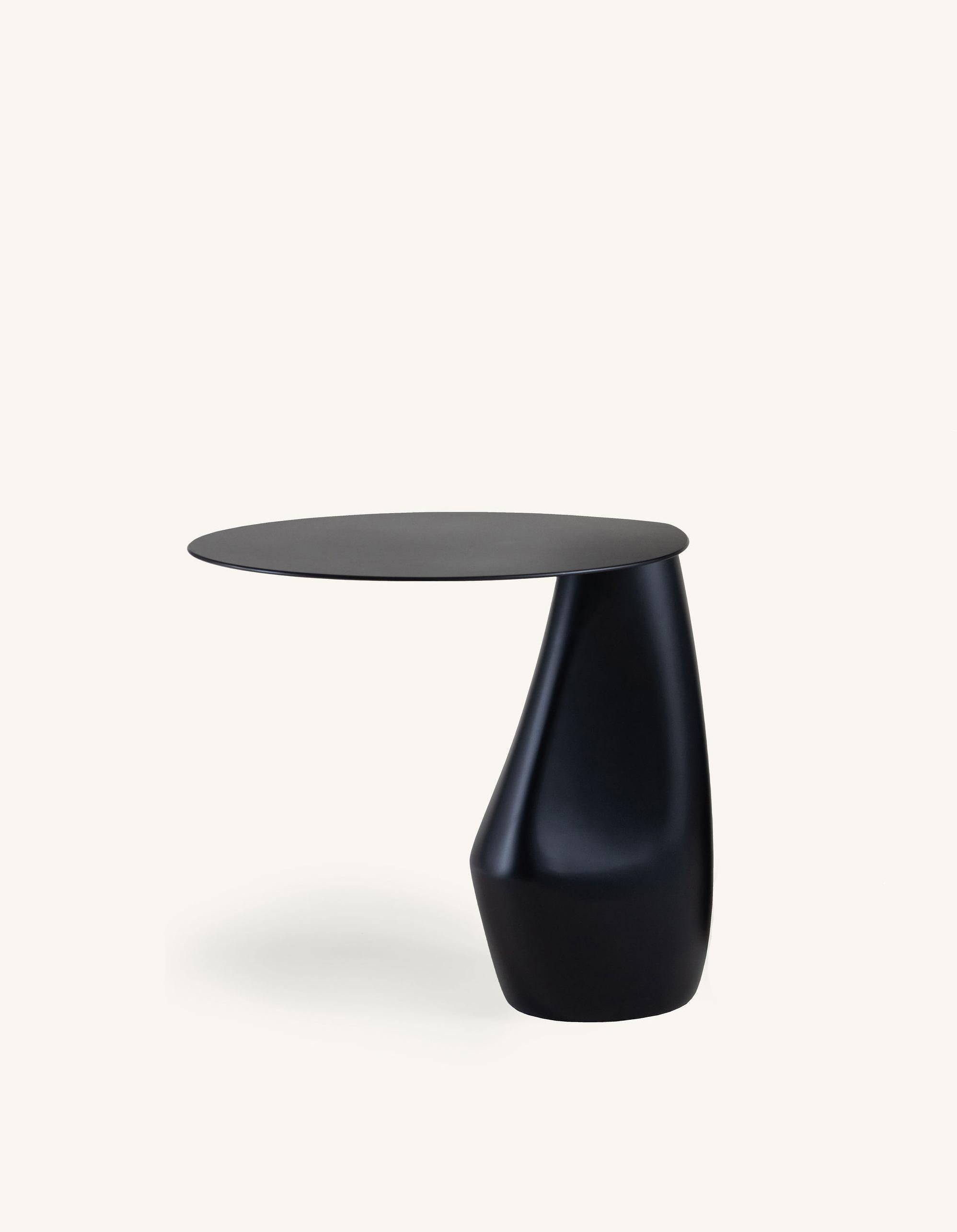 A signature piece from our stone collection, the expertly hand-sculpted Dionis side table evokes the subtle curves and contours of tumbled stones shaped by the ocean. This side table presents as sculpture yet functions as a table. 

Also available