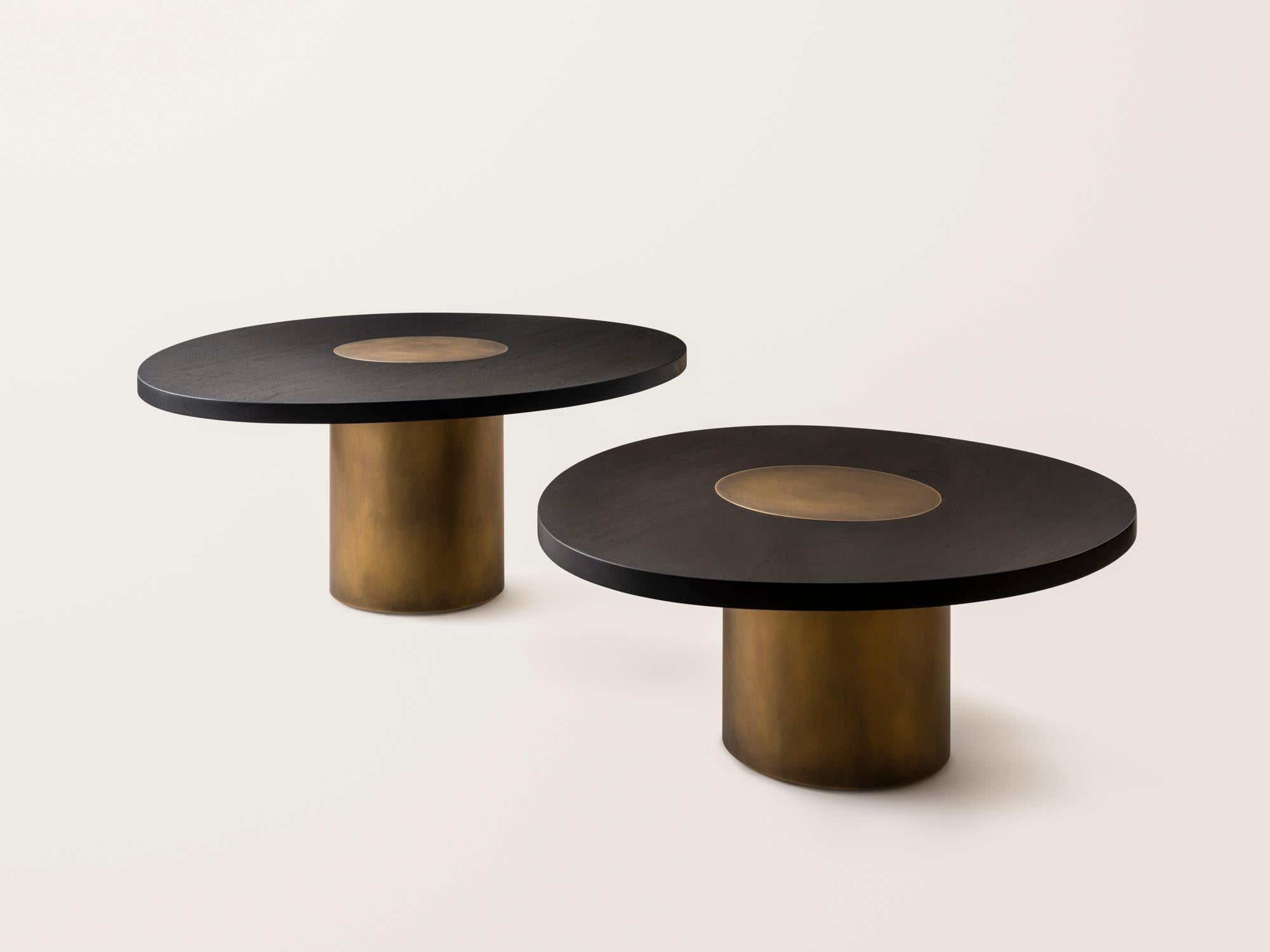 Inspired by the form and function of grain silos, the sculptural Silo Coffee Tables feature solid wood and hand-finished brass wrapped legs.

This listing is for a nesting pair of Small (36